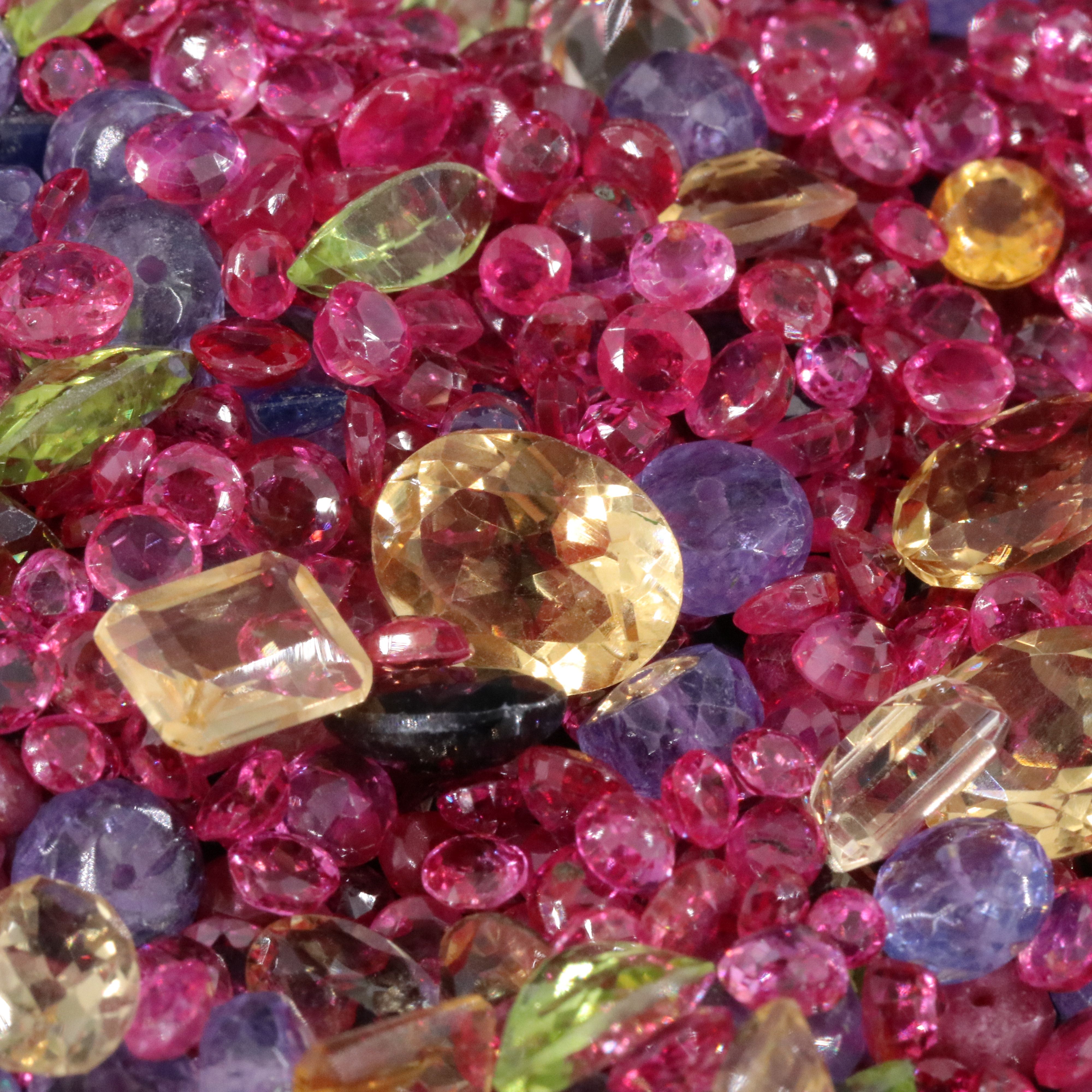Loose 302.60 CTW Gemstone Lot Including Peridot, Tanzanite and Ruby