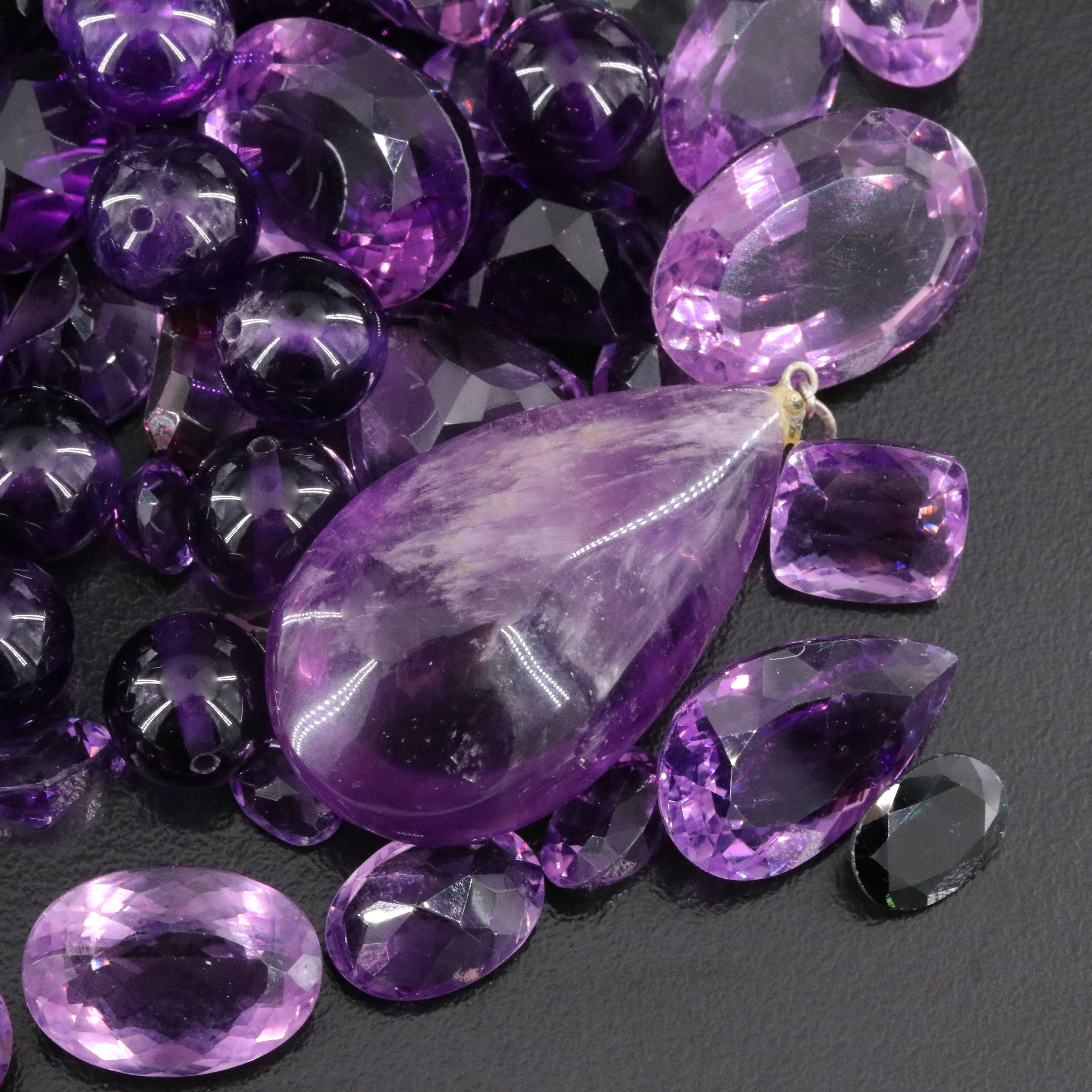 Loose 807.50 CTW Gemstone Lot Including Amethyst and Garnet