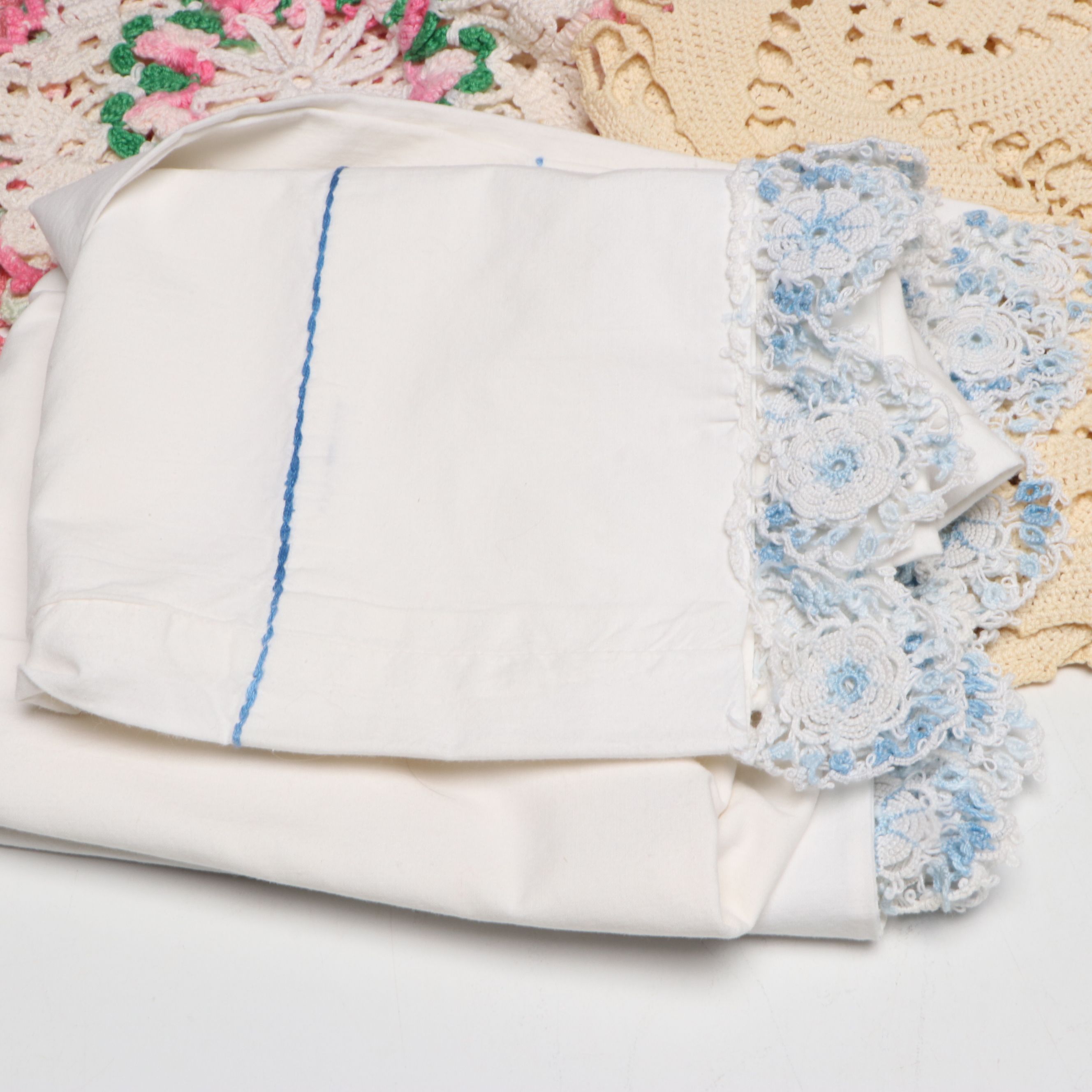 Wood Sewing Rack and Hand-Embroidered Pillowcases with Doilies and Trimmer