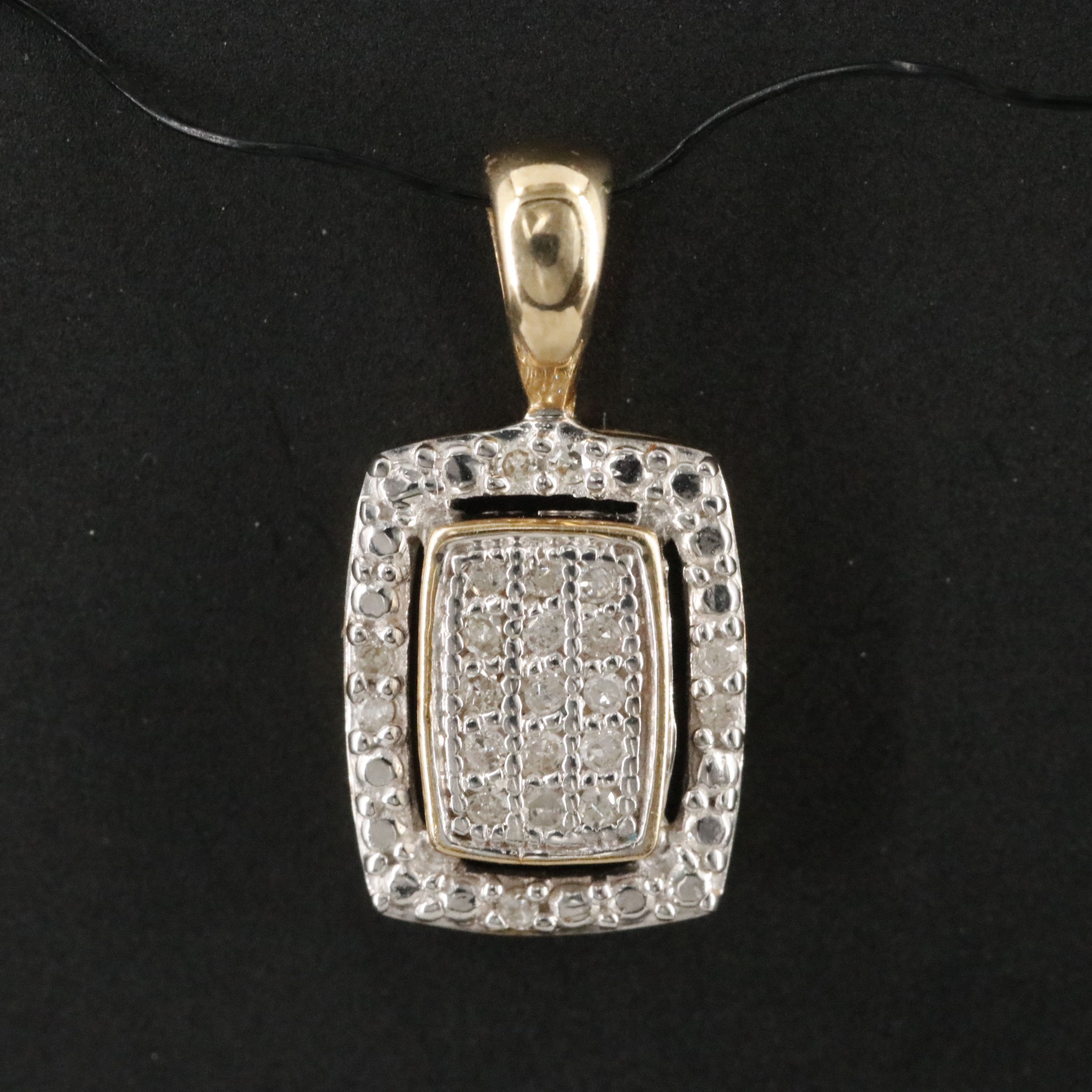 10K 0.07 CTW Diamond Pendant