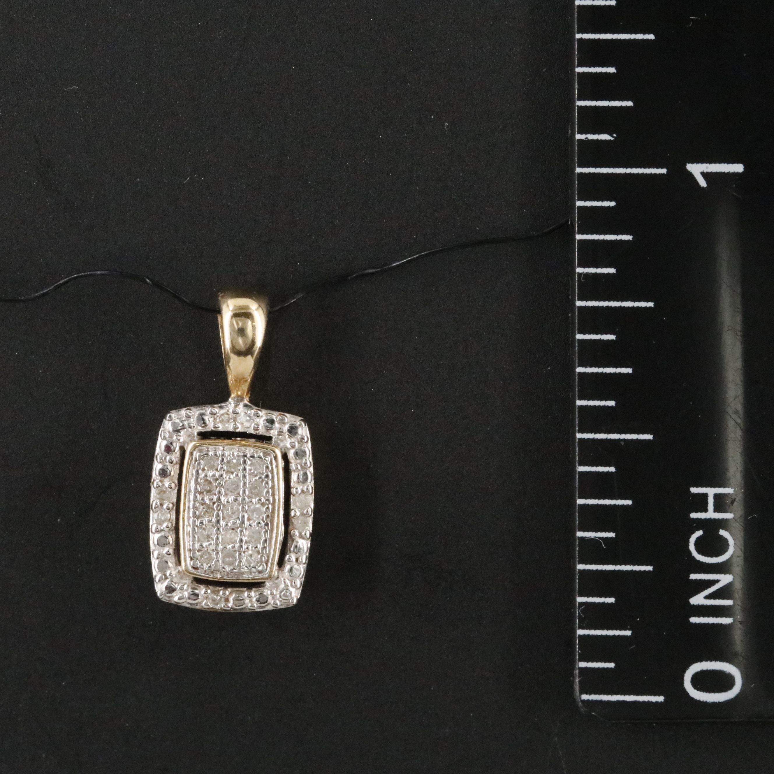10K 0.07 CTW Diamond Pendant