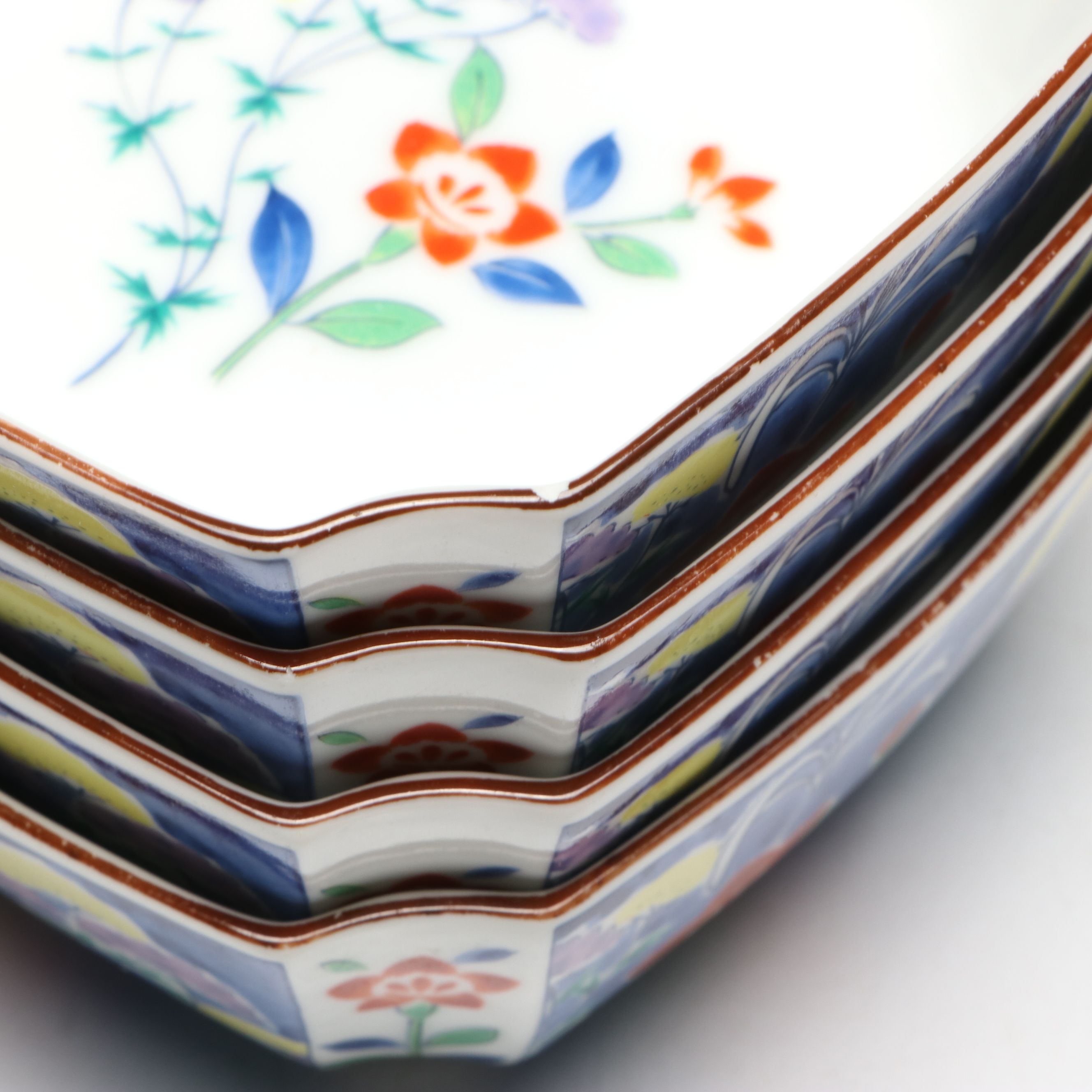 Kozan Gama and Other Japanese Porcelain Bowls with Floral and Radish Motifs