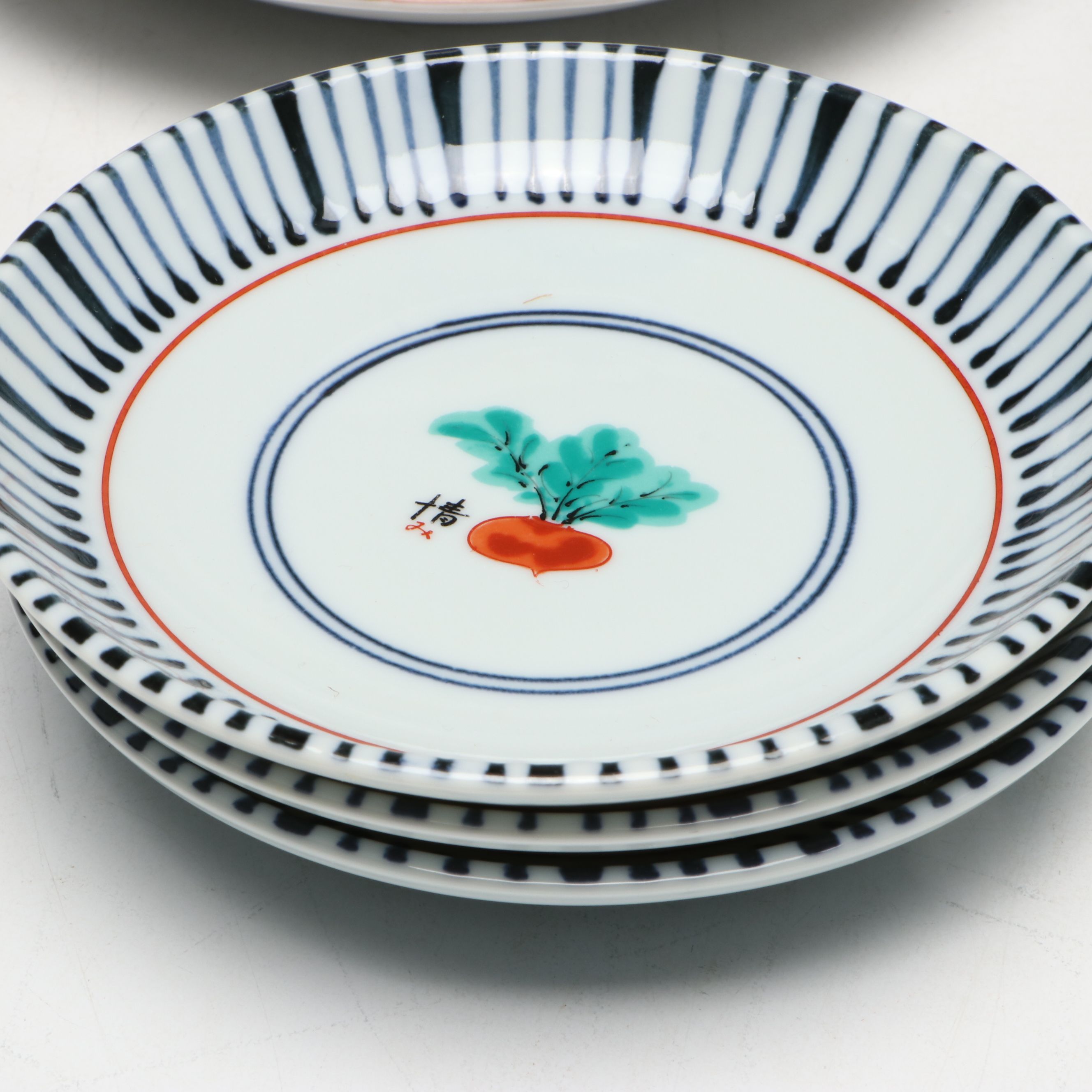 Kozan Gama and Other Japanese Porcelain Bowls with Floral and Radish Motifs