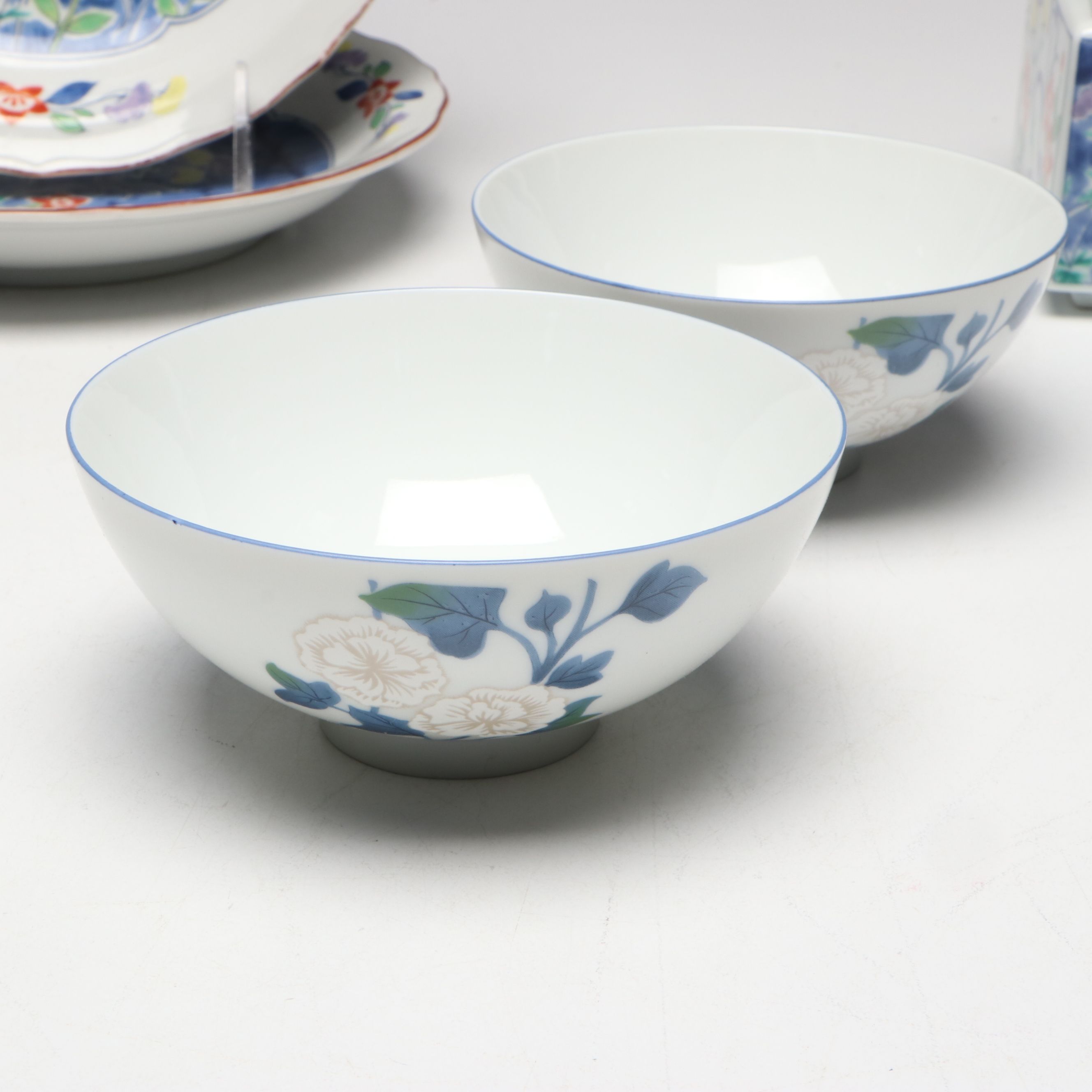 Kozan Gama and Other Japanese Porcelain Bowls with Floral and Radish Motifs