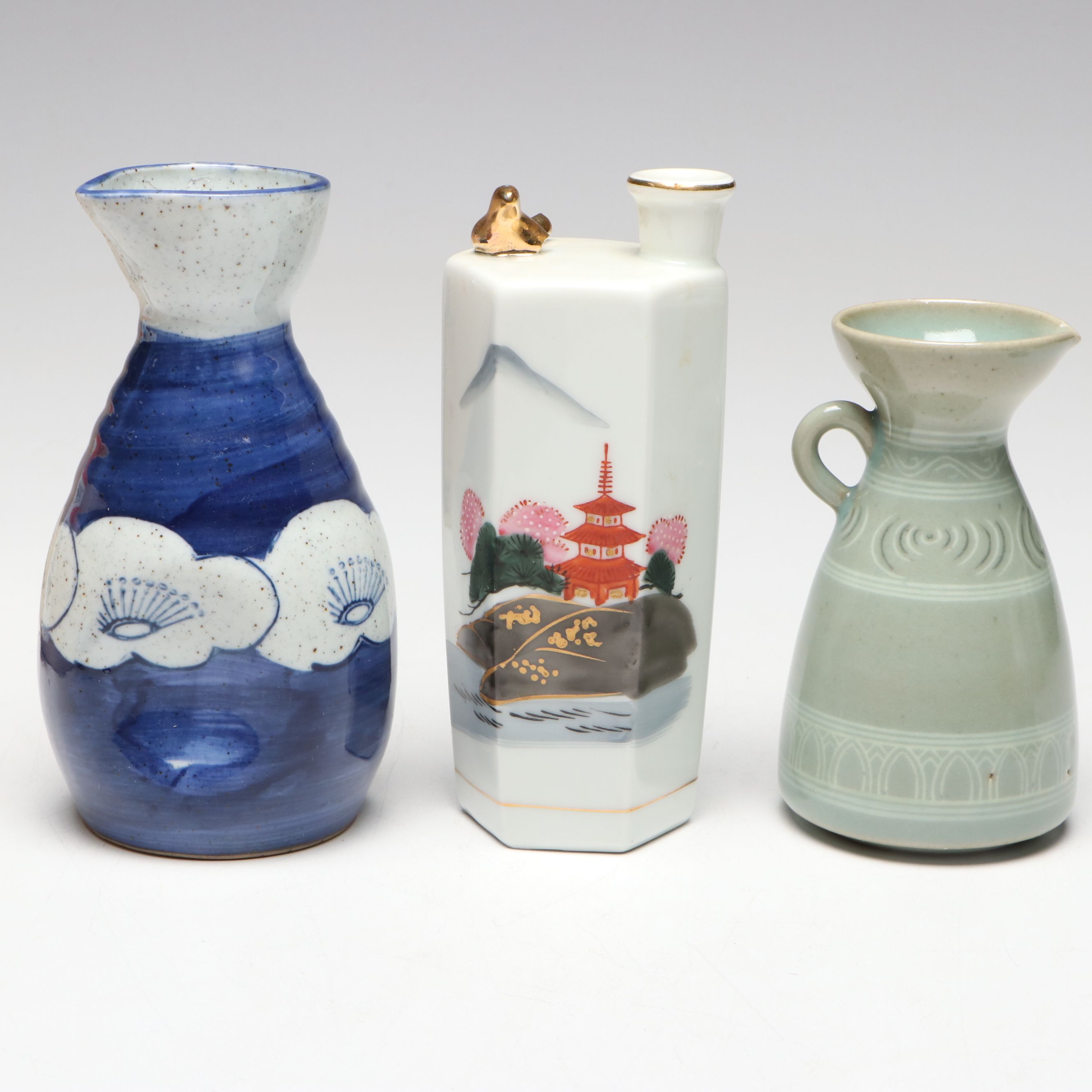 "Kamotsuru" Whistling Bird Porcelain Sake Bottle and Other Sake Carafes
