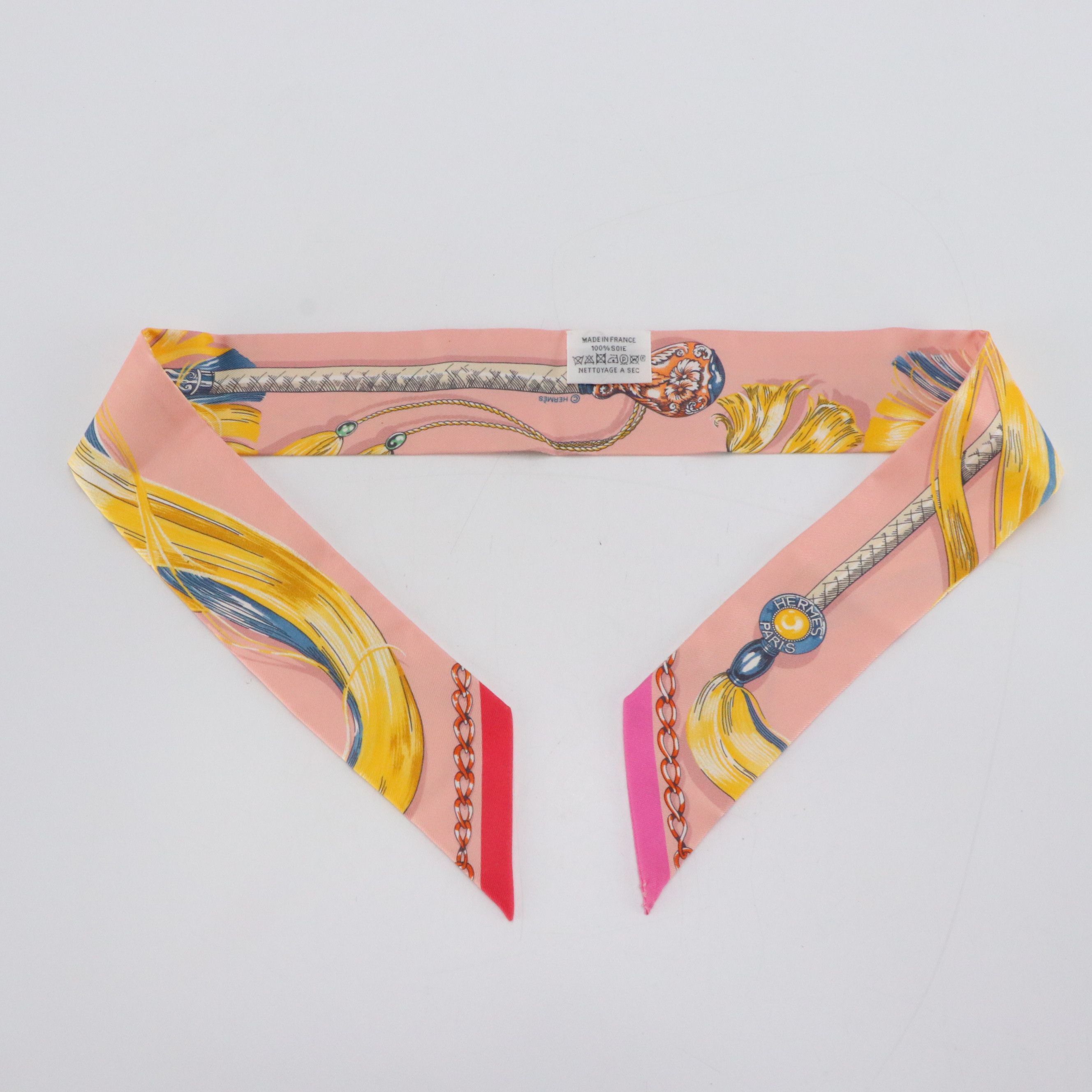 Hermès "Cavalcades" Silk Twilly in Pink Silk