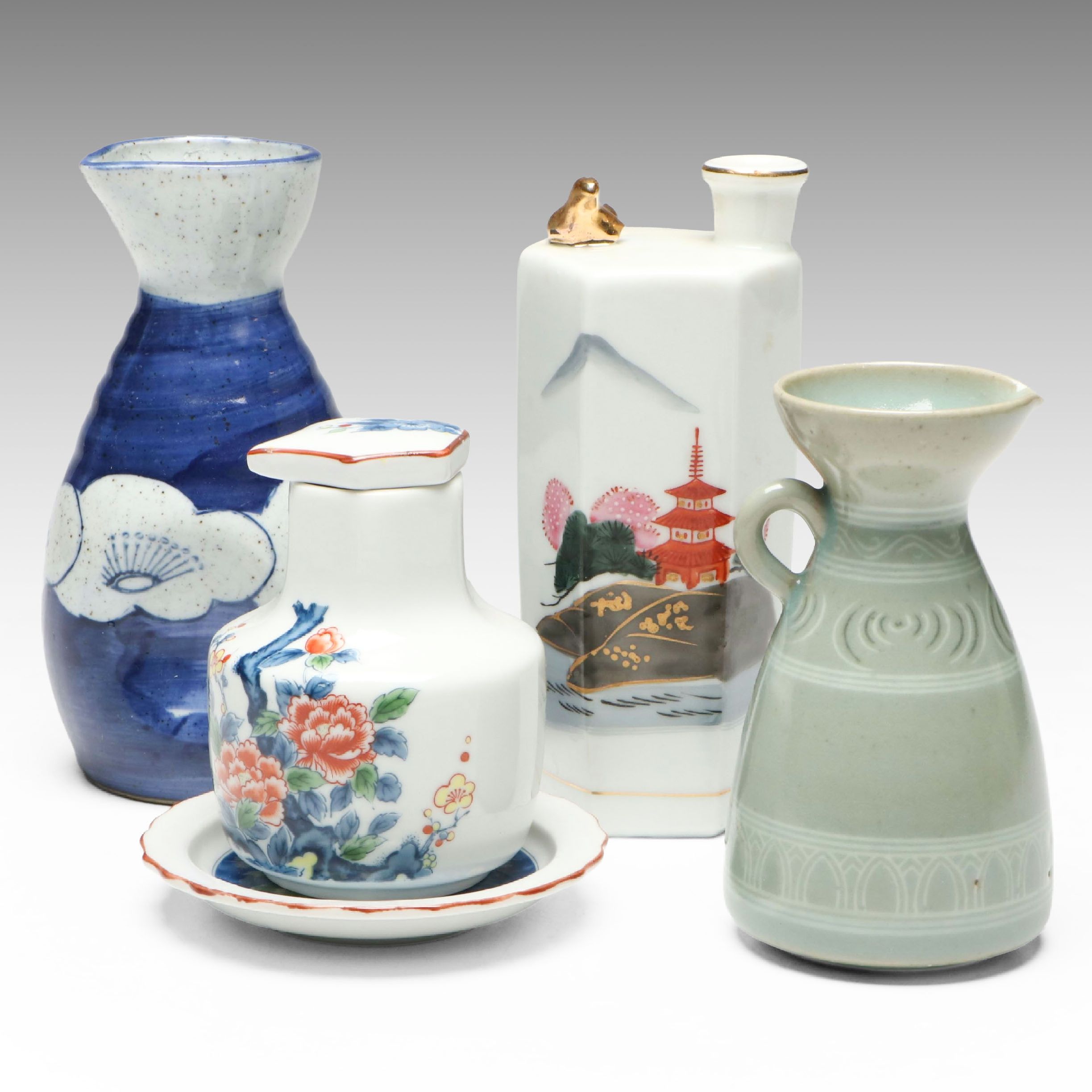 "Kamotsuru" Whistling Bird Porcelain Sake Bottle and Other Sake Carafes