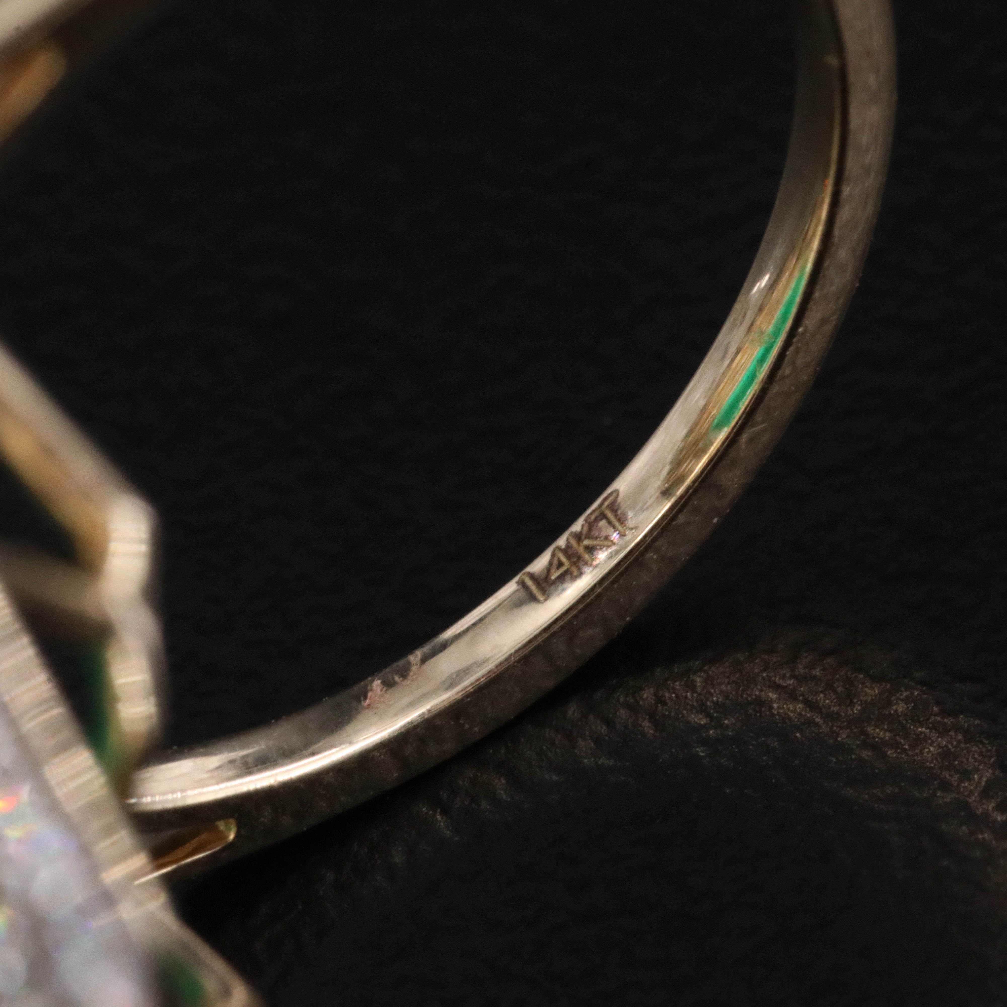 14K 7.38 CTW Emerald Ring with 1.91 CTW Diamond Halo