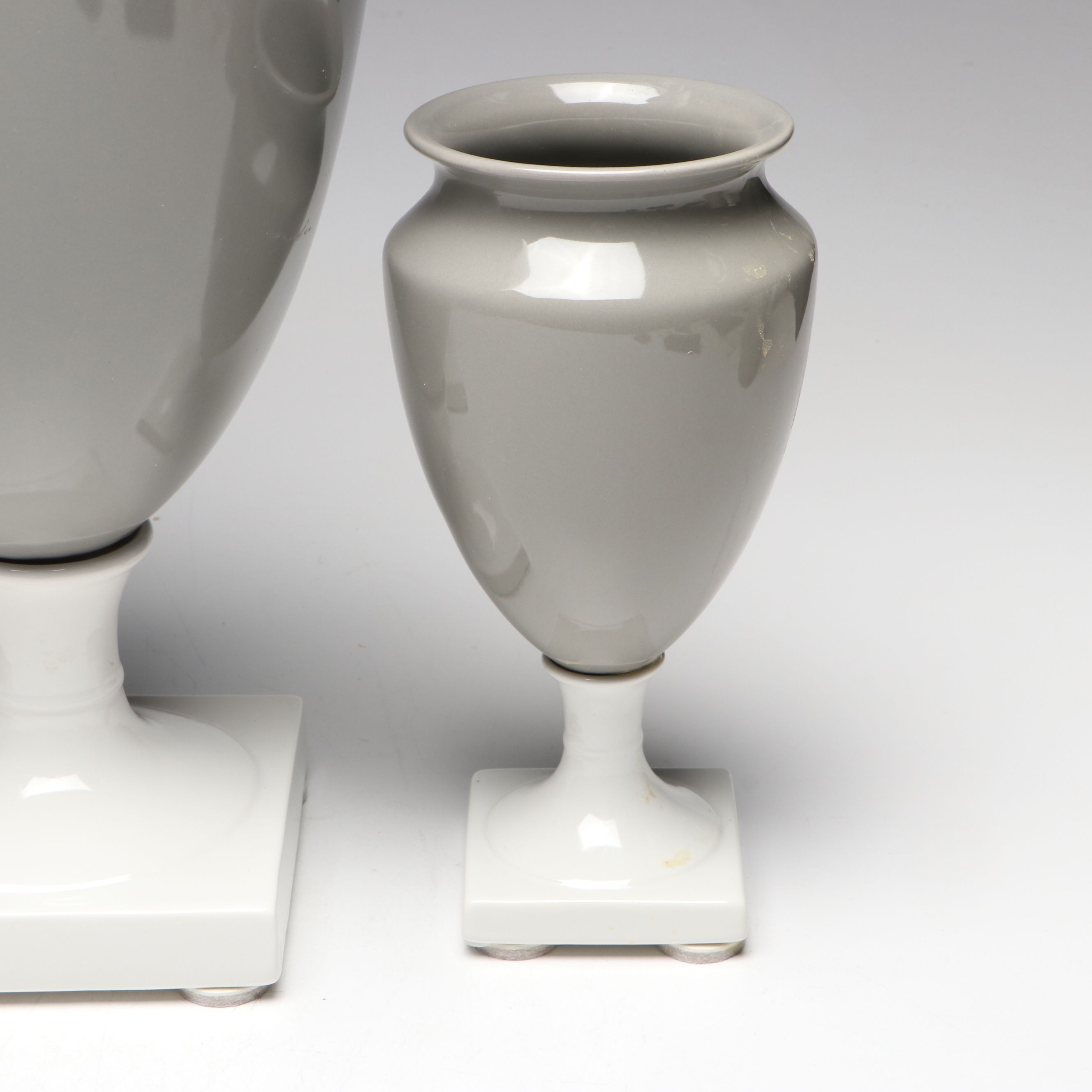 Gray and White Ceramic Urn and Vases