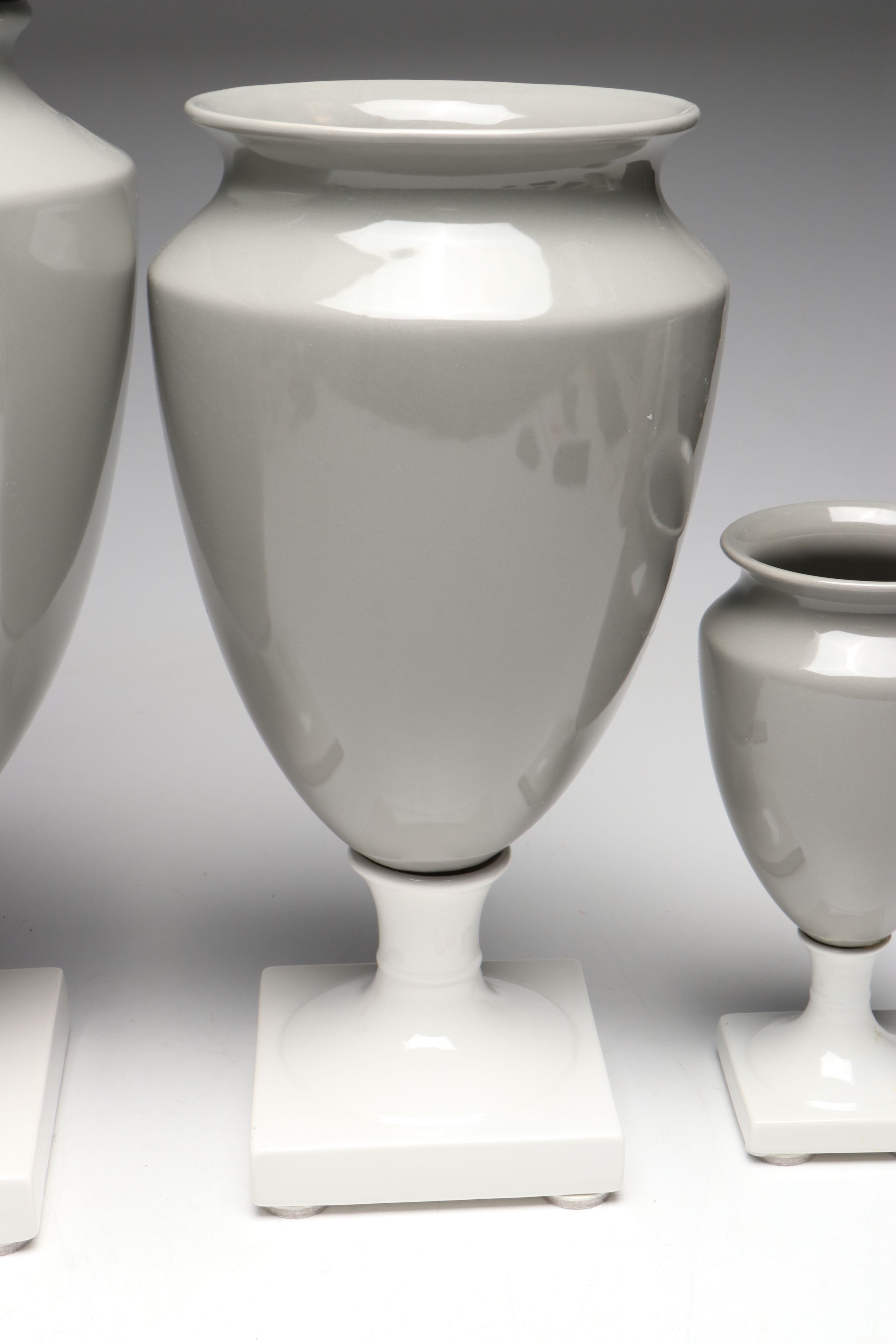 Gray and White Ceramic Urn and Vases