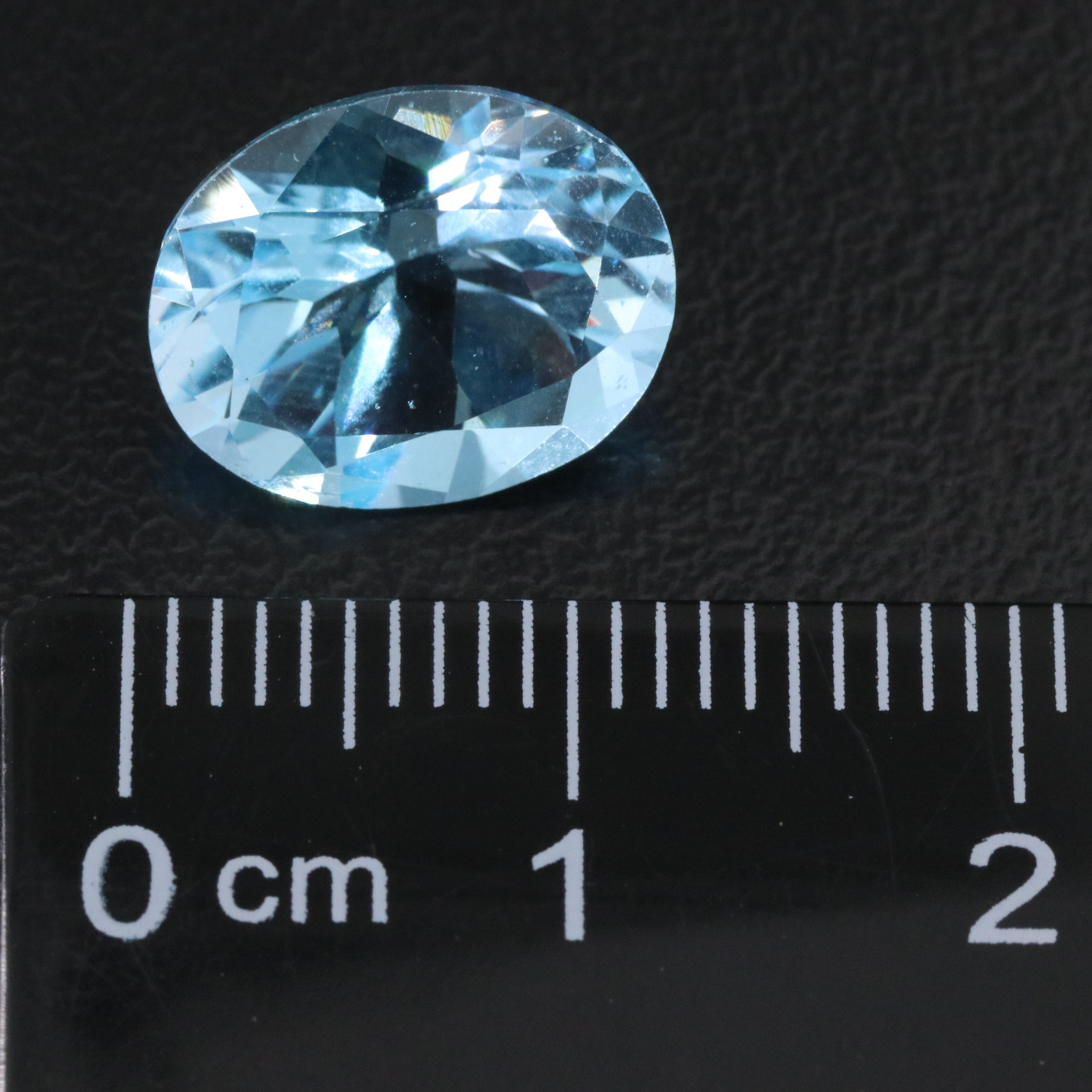 Loose 11.71 CTW Gemstone Lot Including Topaz, Ruby and Opal