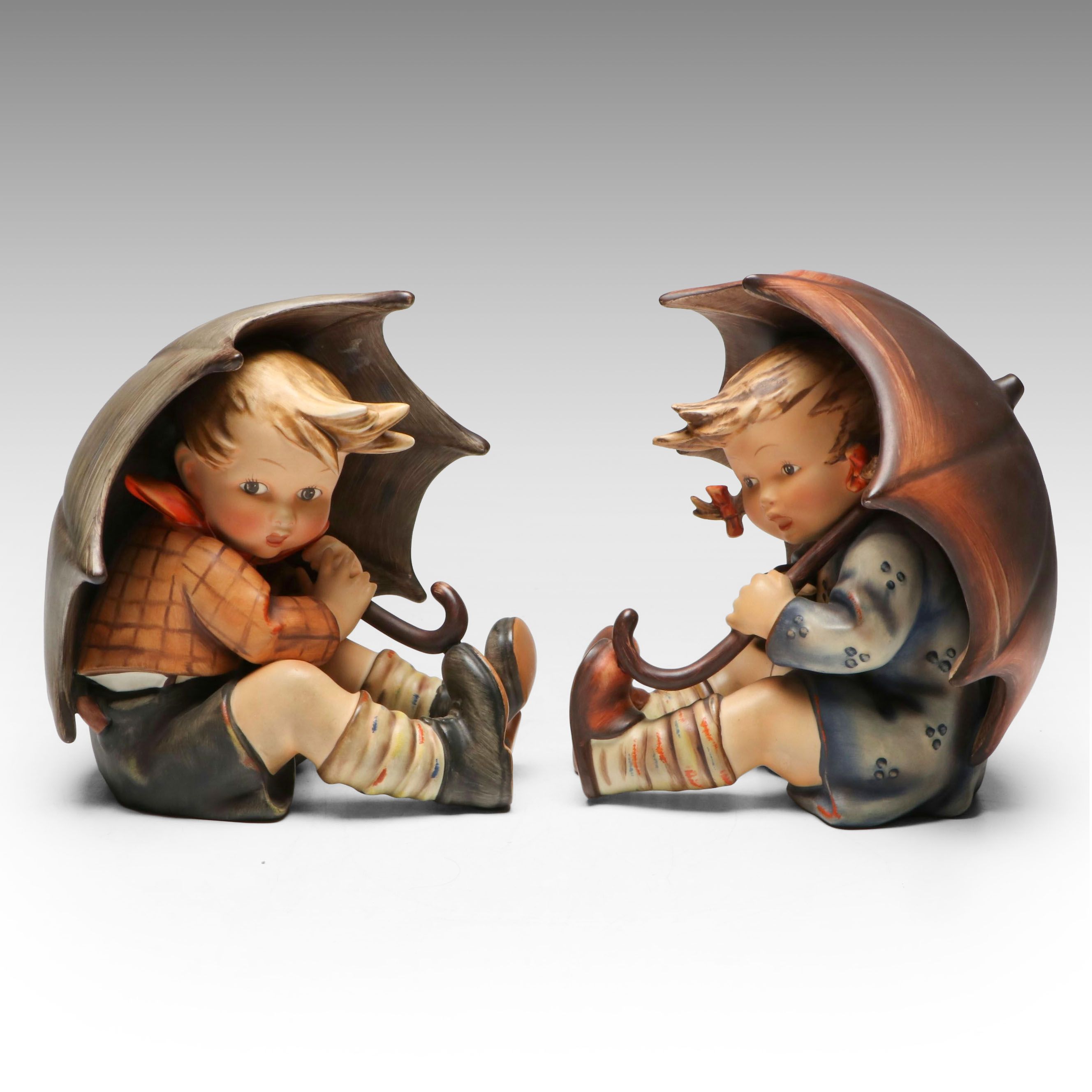 Goebel "Umbrella Boy" and "Umbrella Girl" Porcelain Hummel Bookends