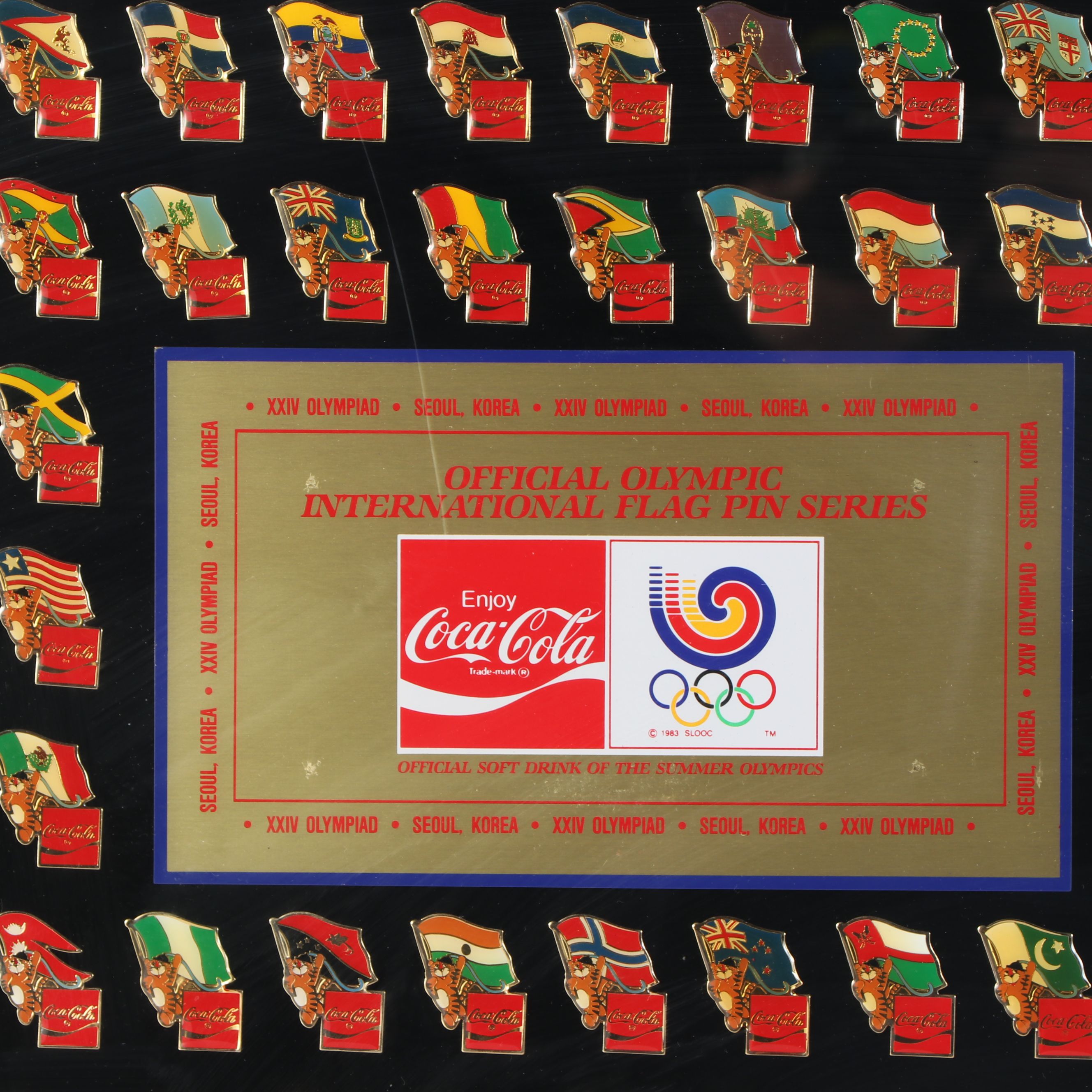 Framed Olympic and Coca-Cola International Flag Pin Set, 1983