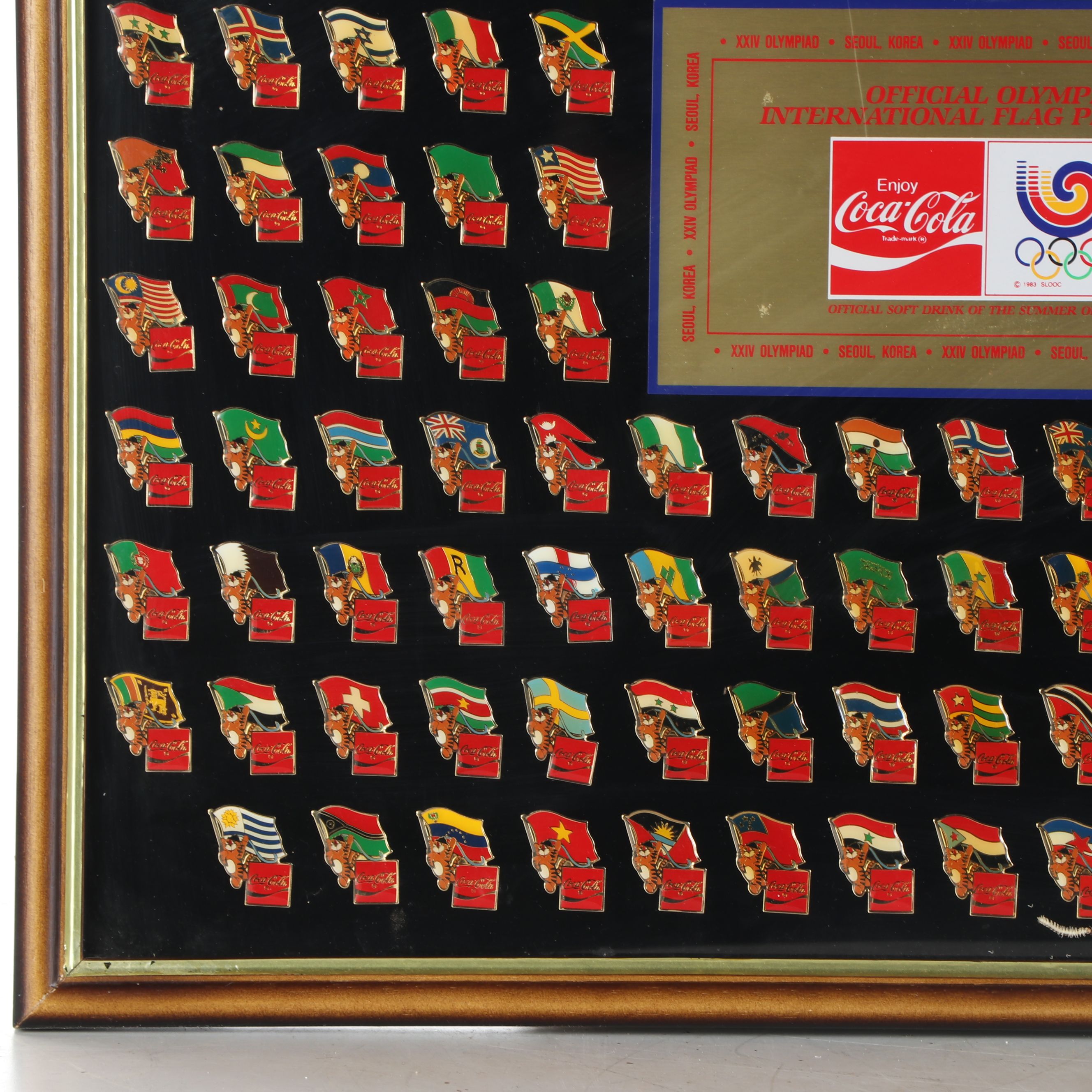 Framed Olympic and Coca-Cola International Flag Pin Set, 1983
