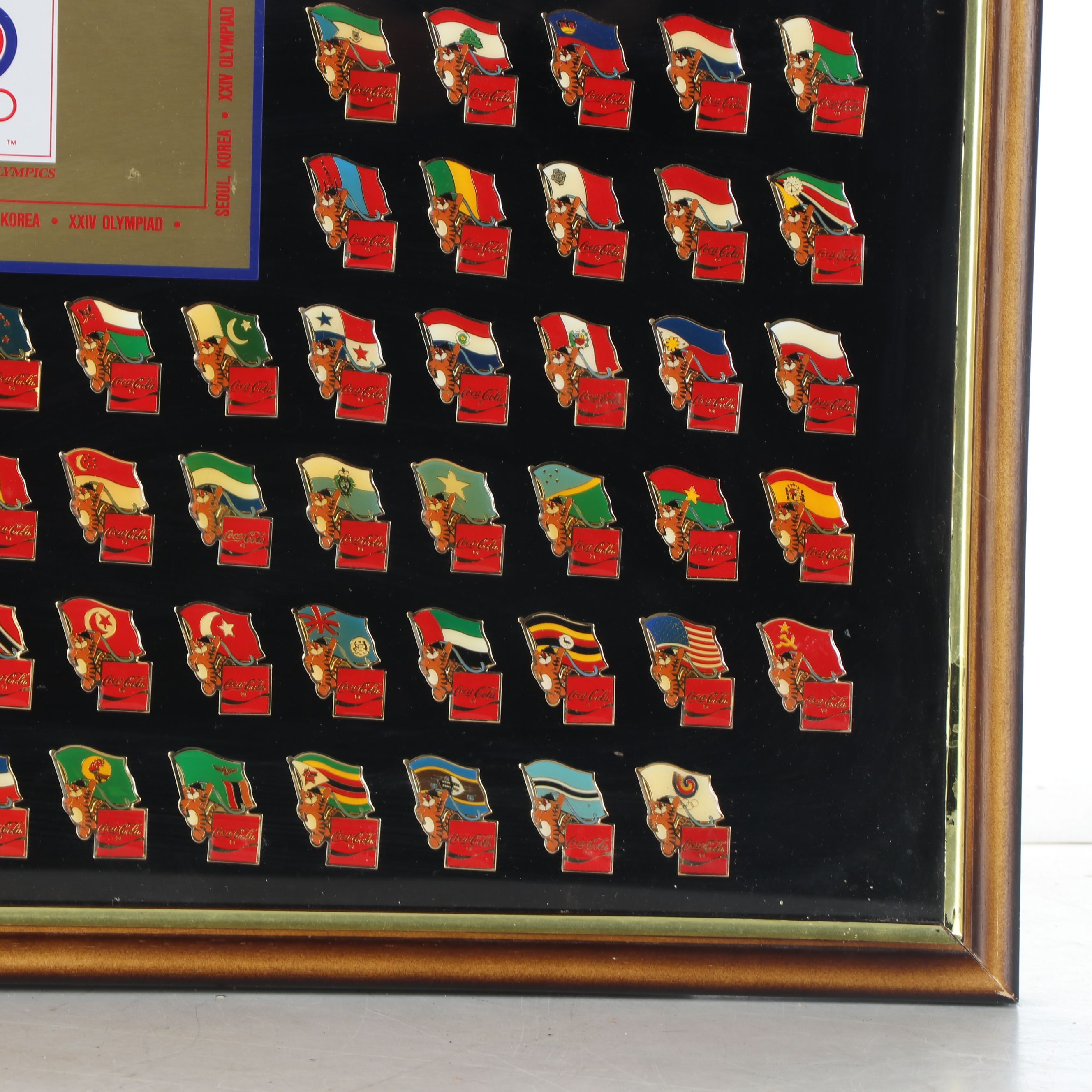 Framed Olympic and Coca-Cola International Flag Pin Set, 1983