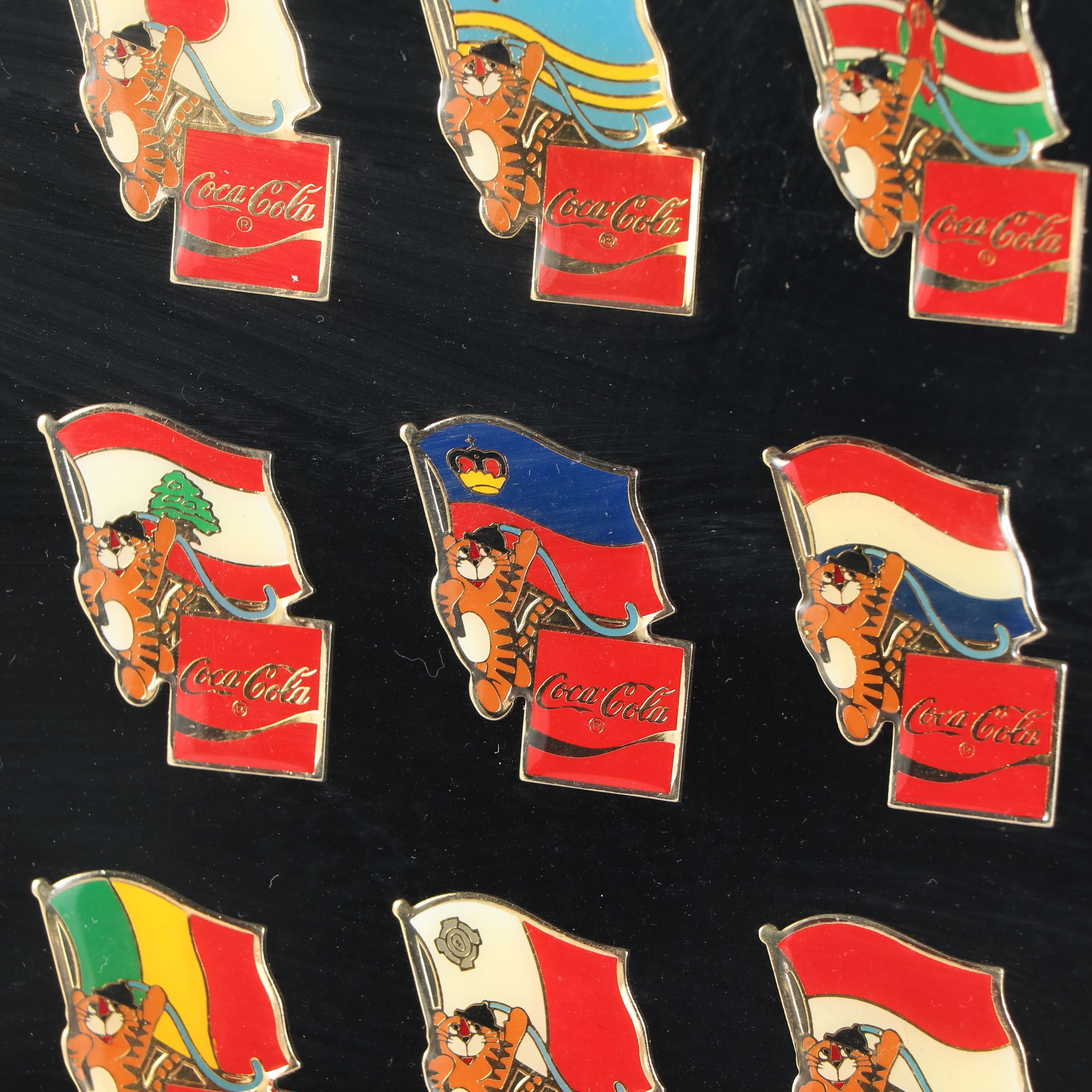 Framed Olympic and Coca-Cola International Flag Pin Set, 1983