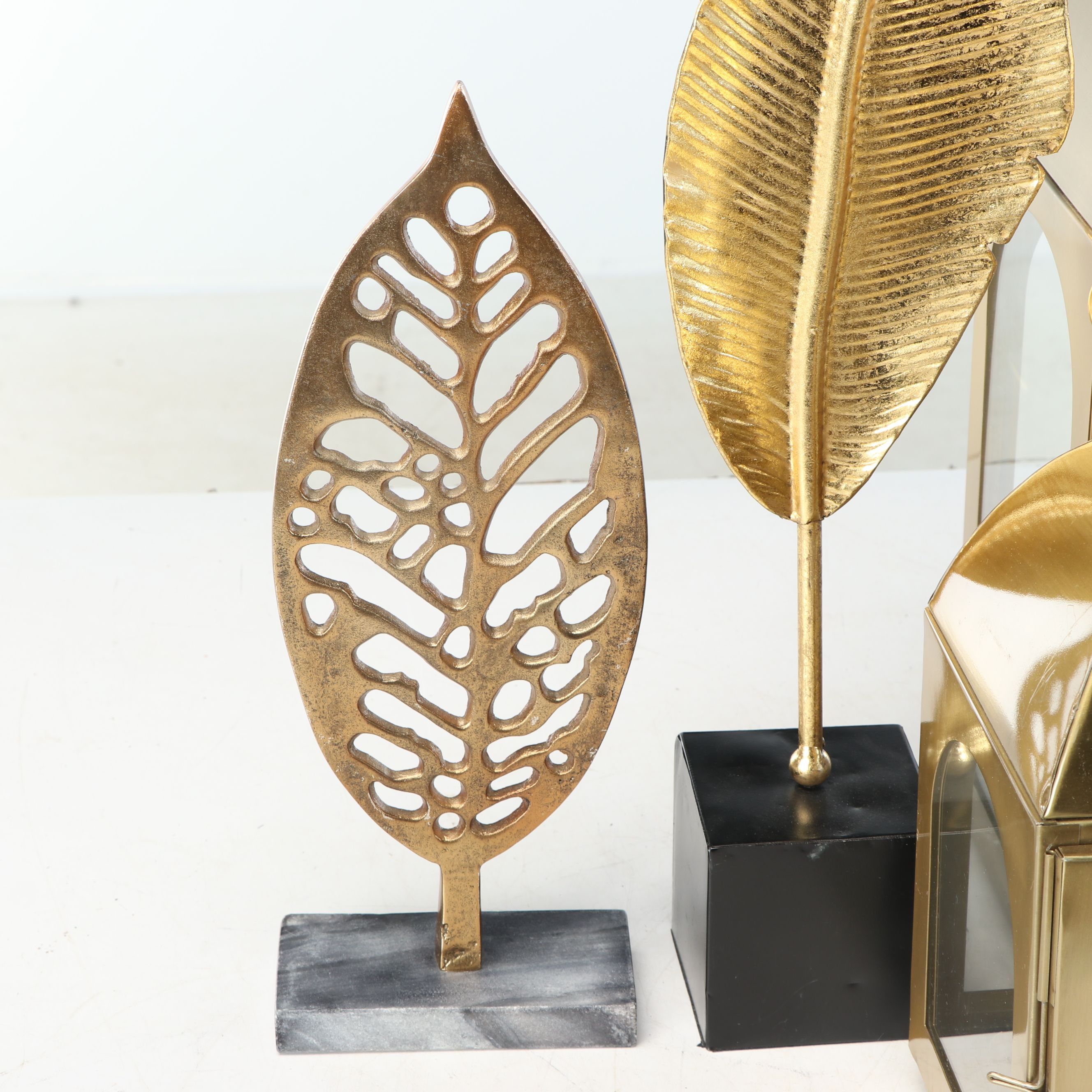 Brass Finish Lanterns with Sculptural Metal Leaves and More Décor