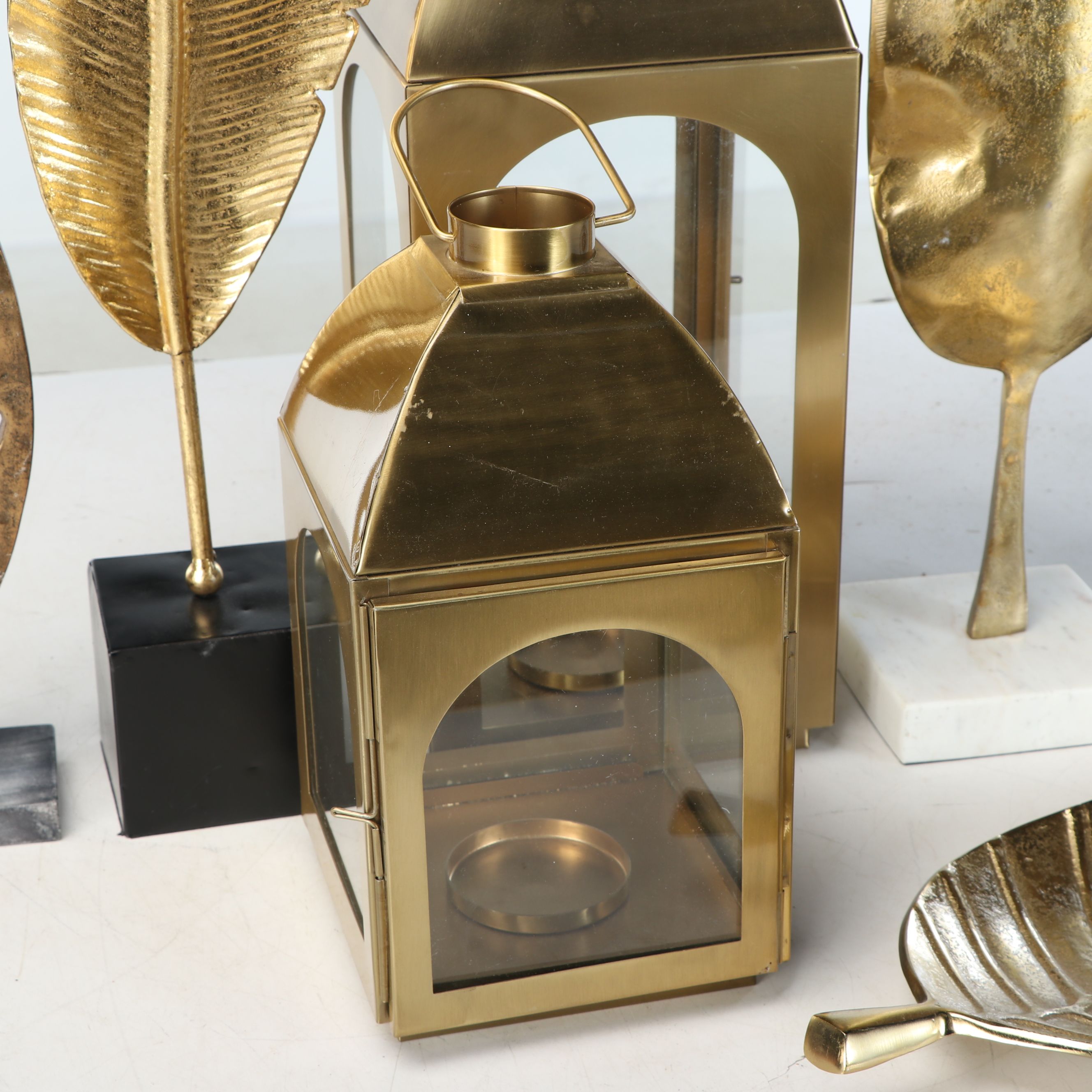 Brass Finish Lanterns with Sculptural Metal Leaves and More Décor
