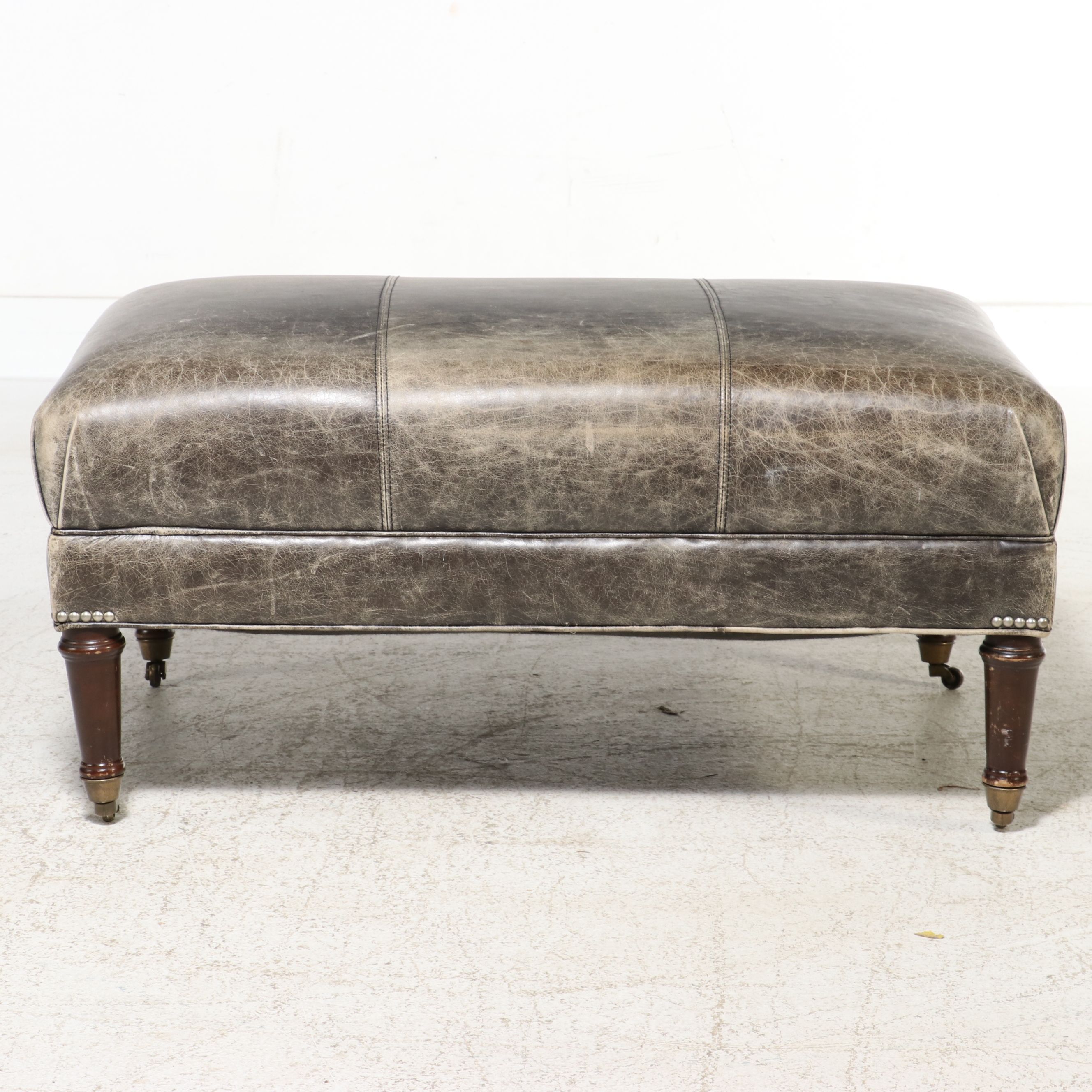 Contemporary Edwardian Style Distressed Leather Cocktail Ottoman on Casters
