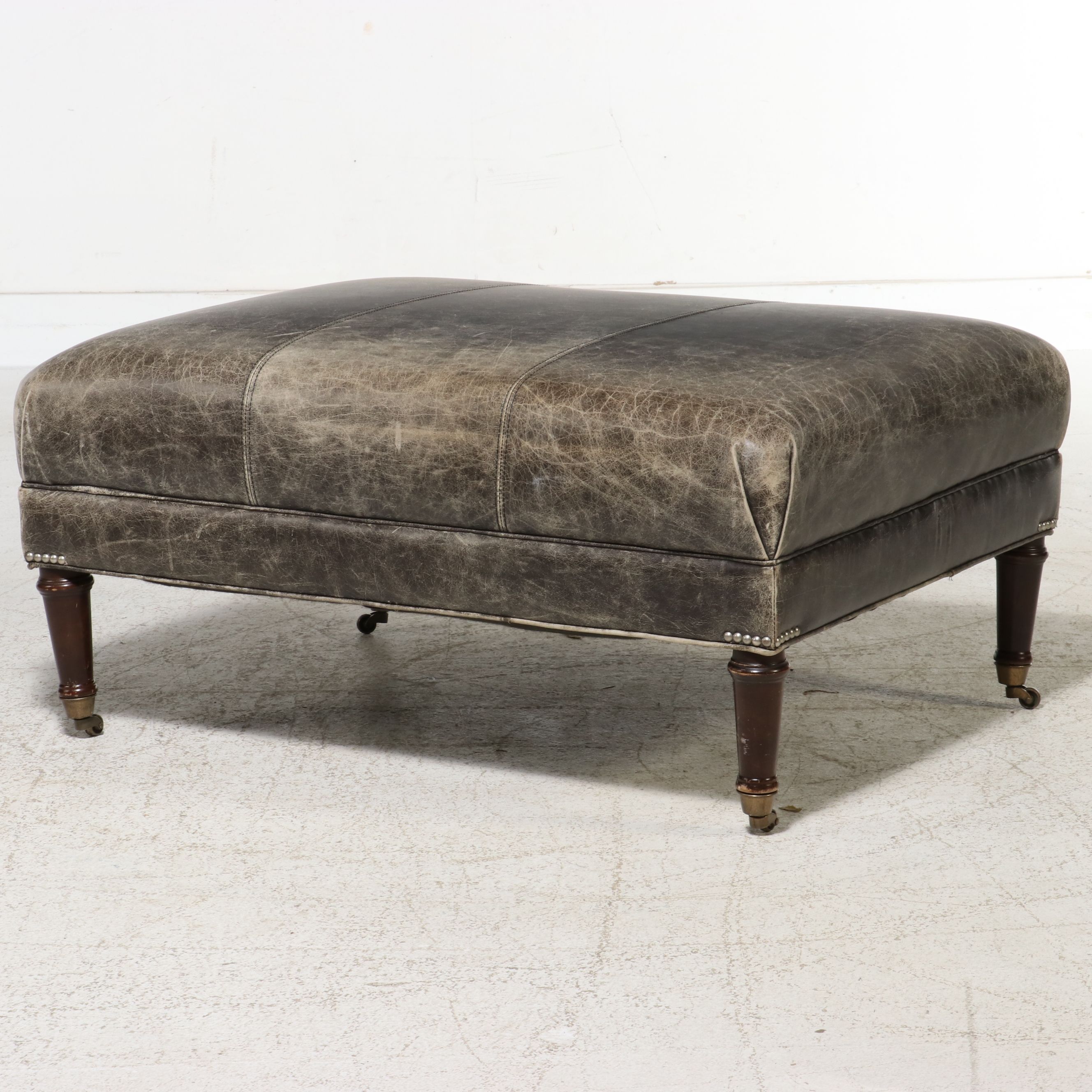 Contemporary Edwardian Style Distressed Leather Cocktail Ottoman on Casters