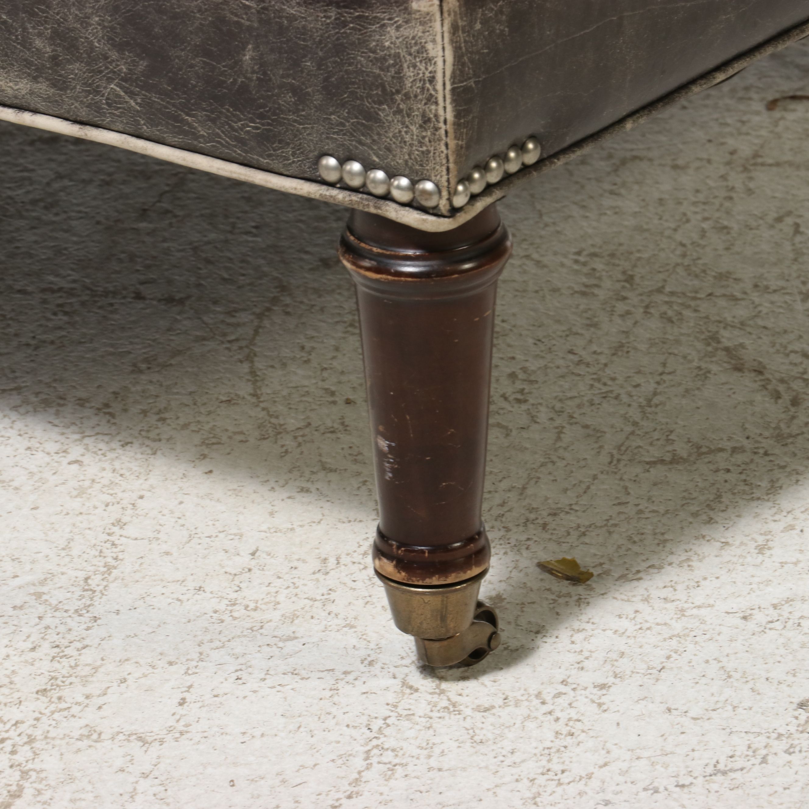 Contemporary Edwardian Style Distressed Leather Cocktail Ottoman on Casters