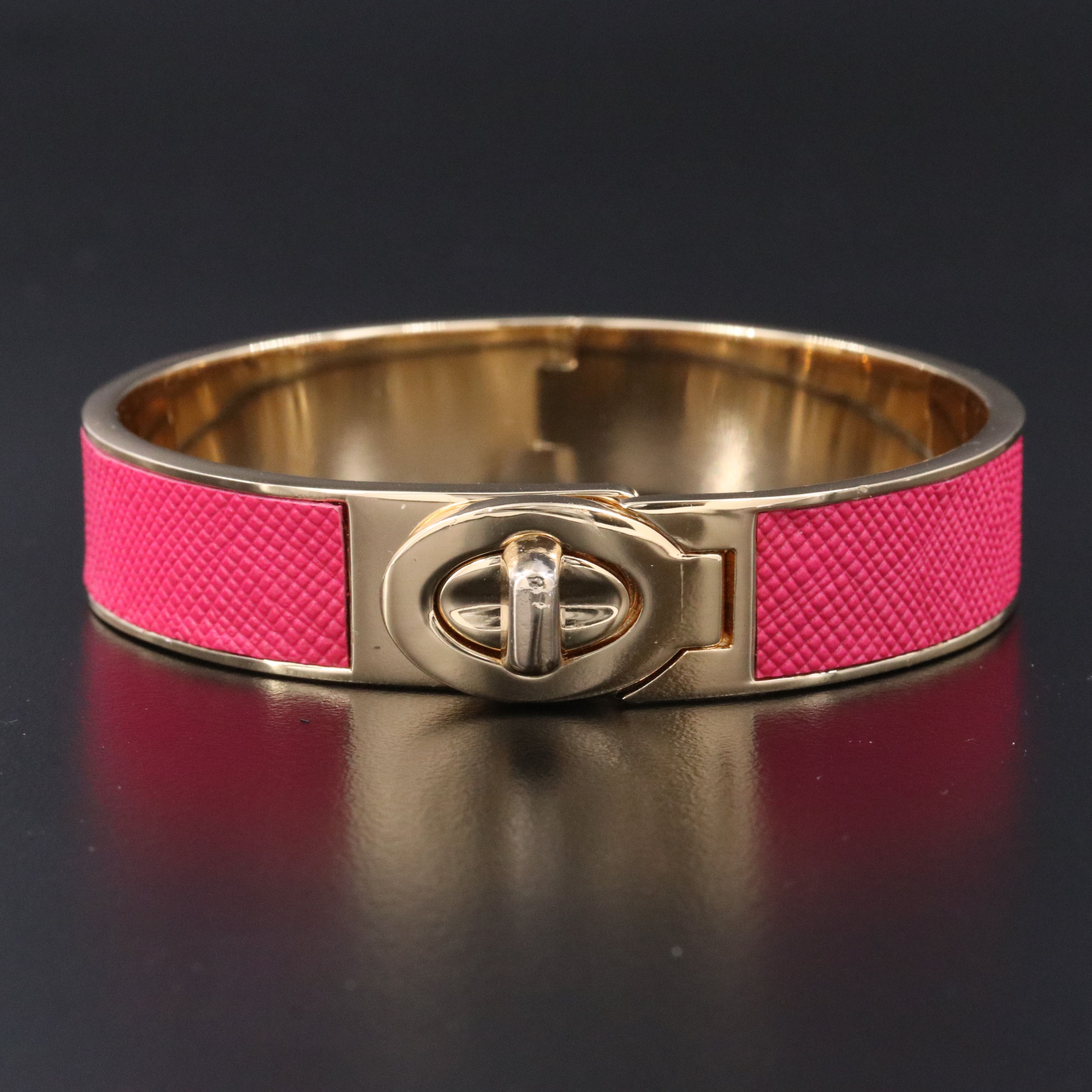 Coach textured pink latch bracelet