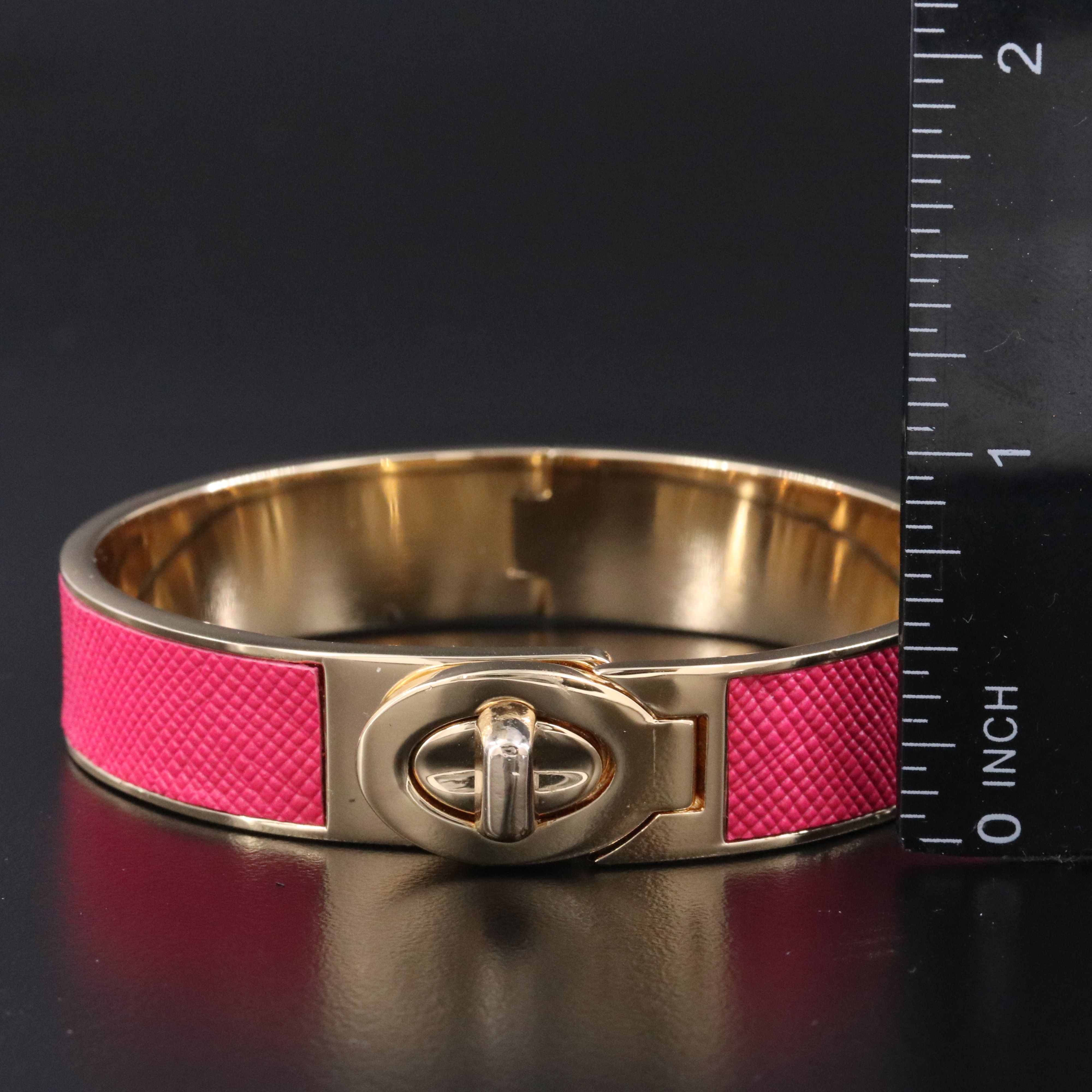 Coach textured pink latch bracelet