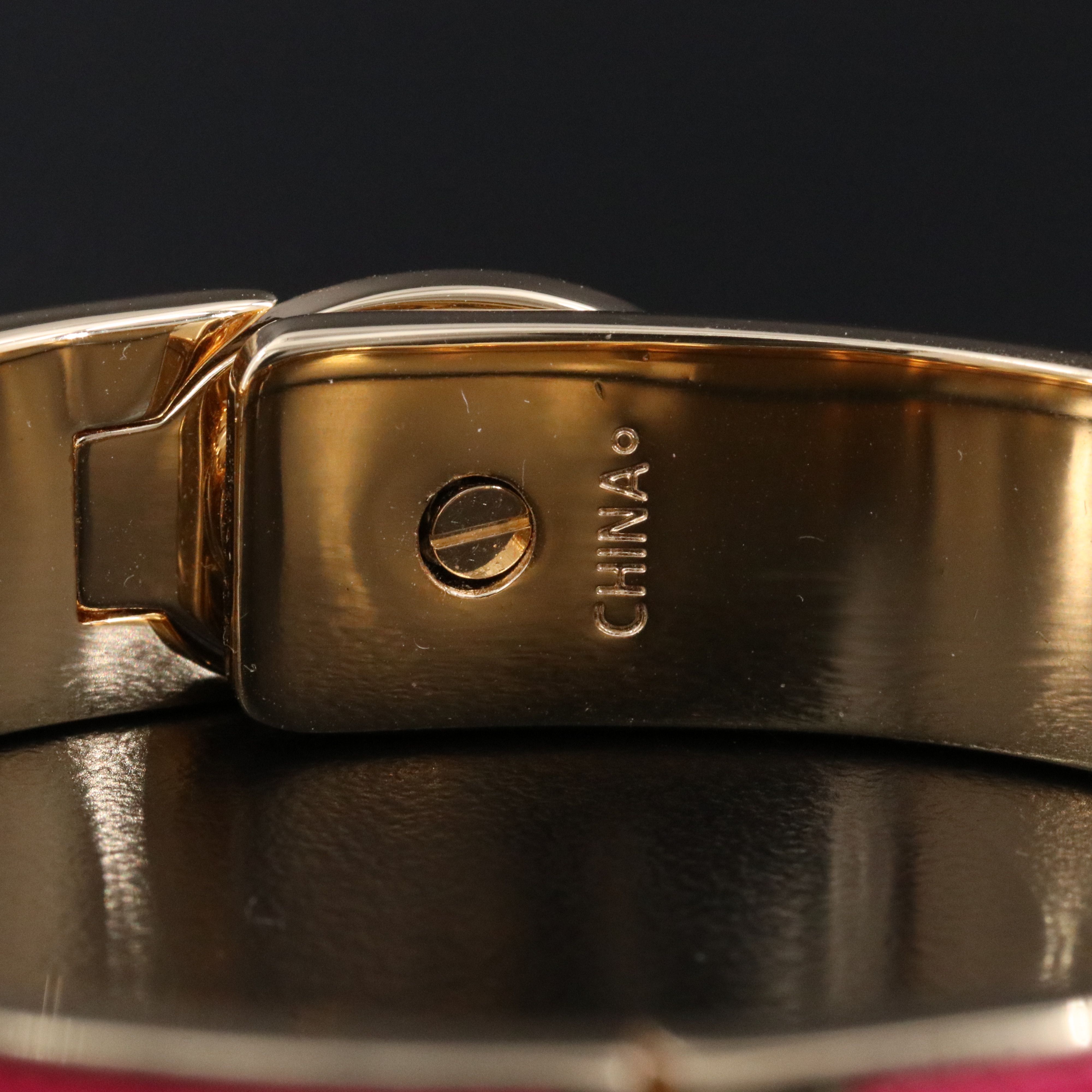 Coach textured pink latch bracelet