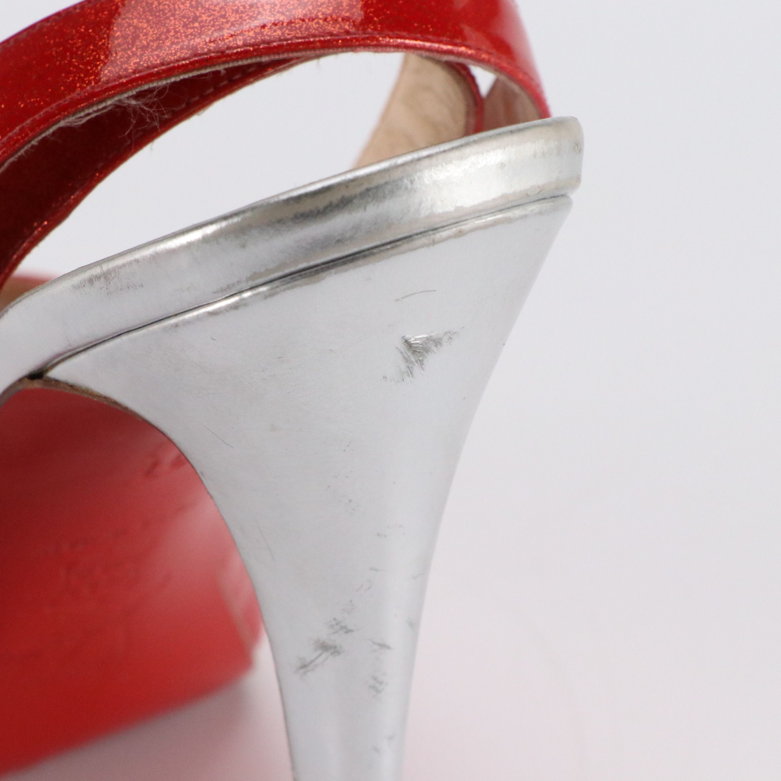 Christian Louboutin Peep Toe Ankle Strap Pumps in Red Glittered Patent Leather