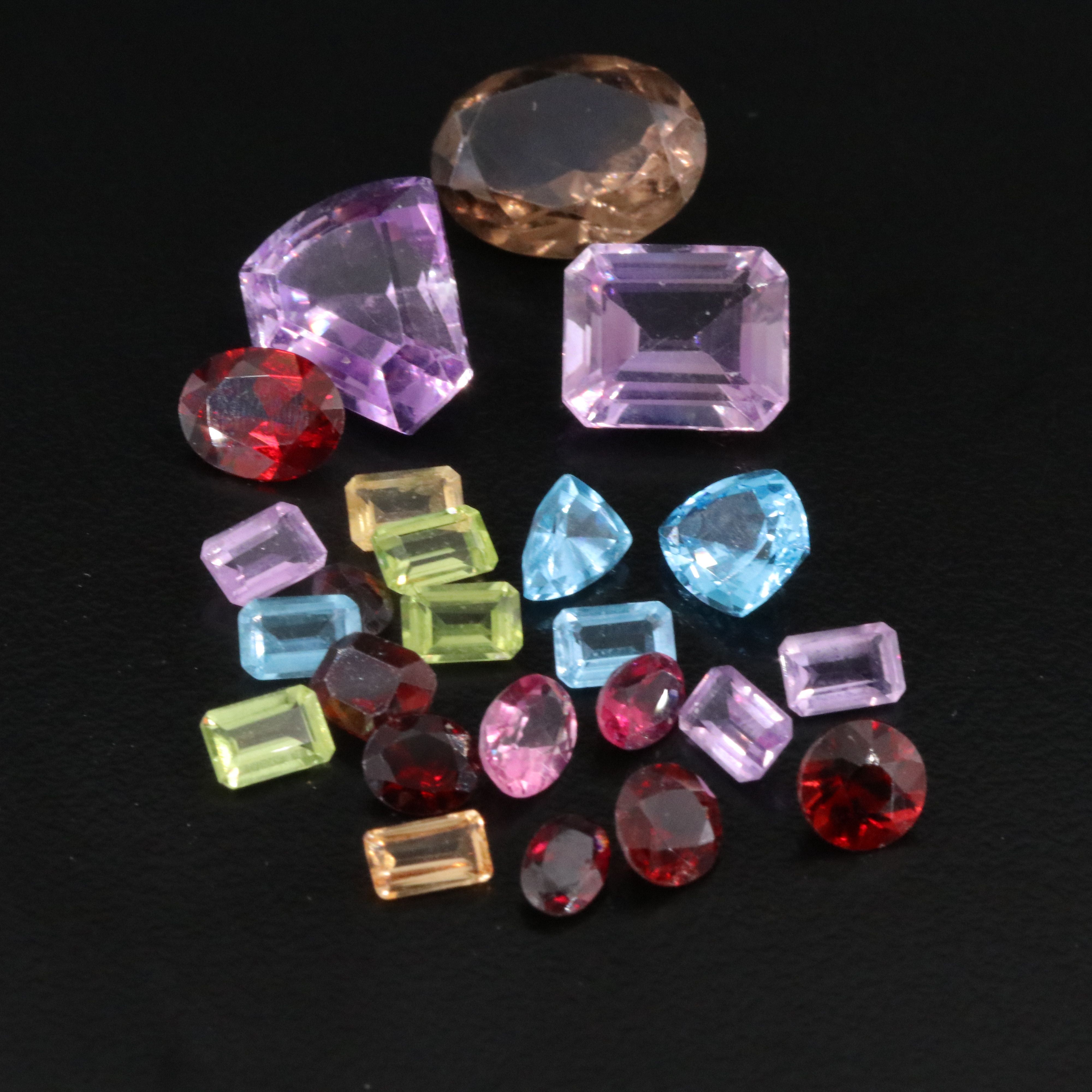 Loose 38.54 CTW Gemstone Lot Including Garnet, Peridot and Amethyst