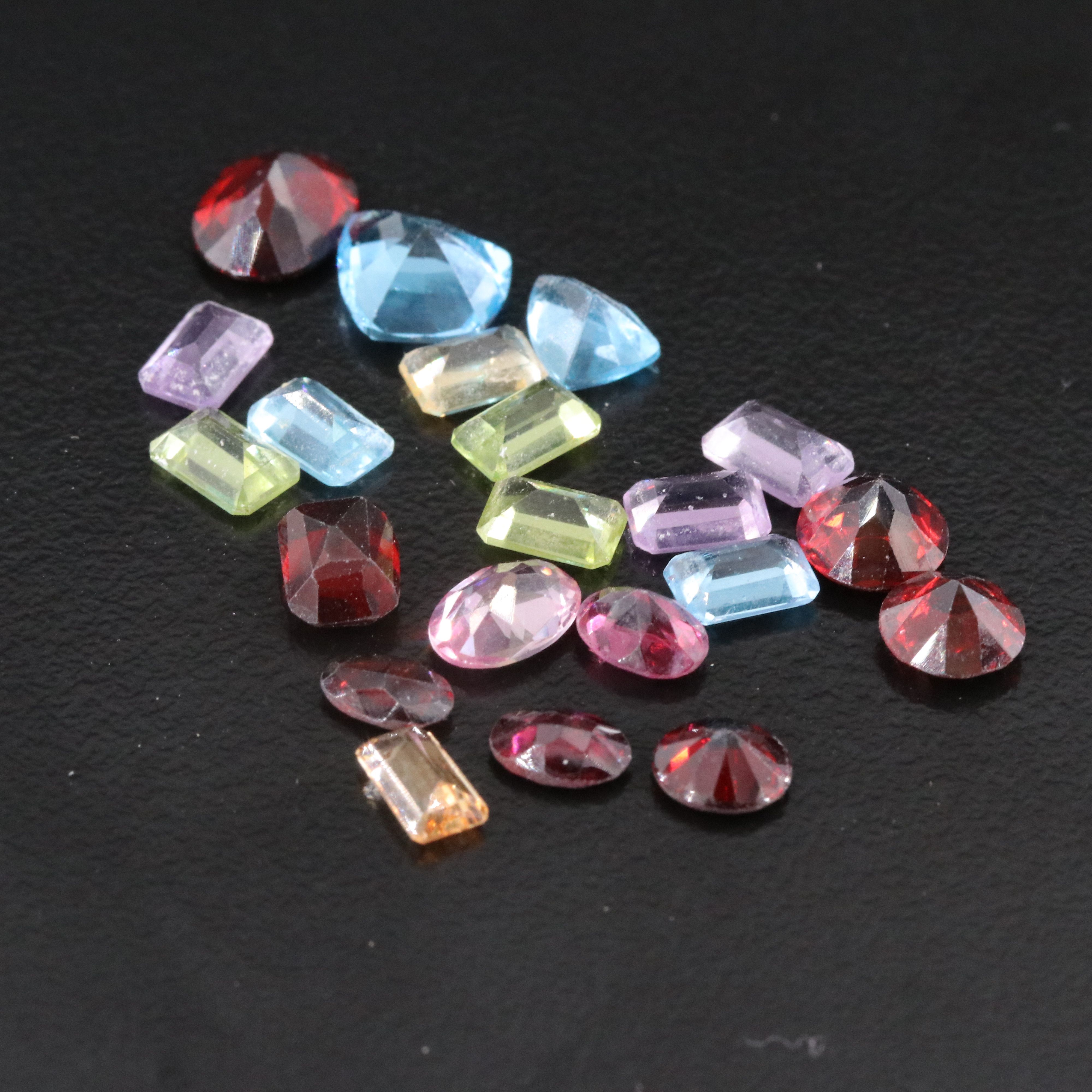 Loose 38.54 CTW Gemstone Lot Including Garnet, Peridot and Amethyst