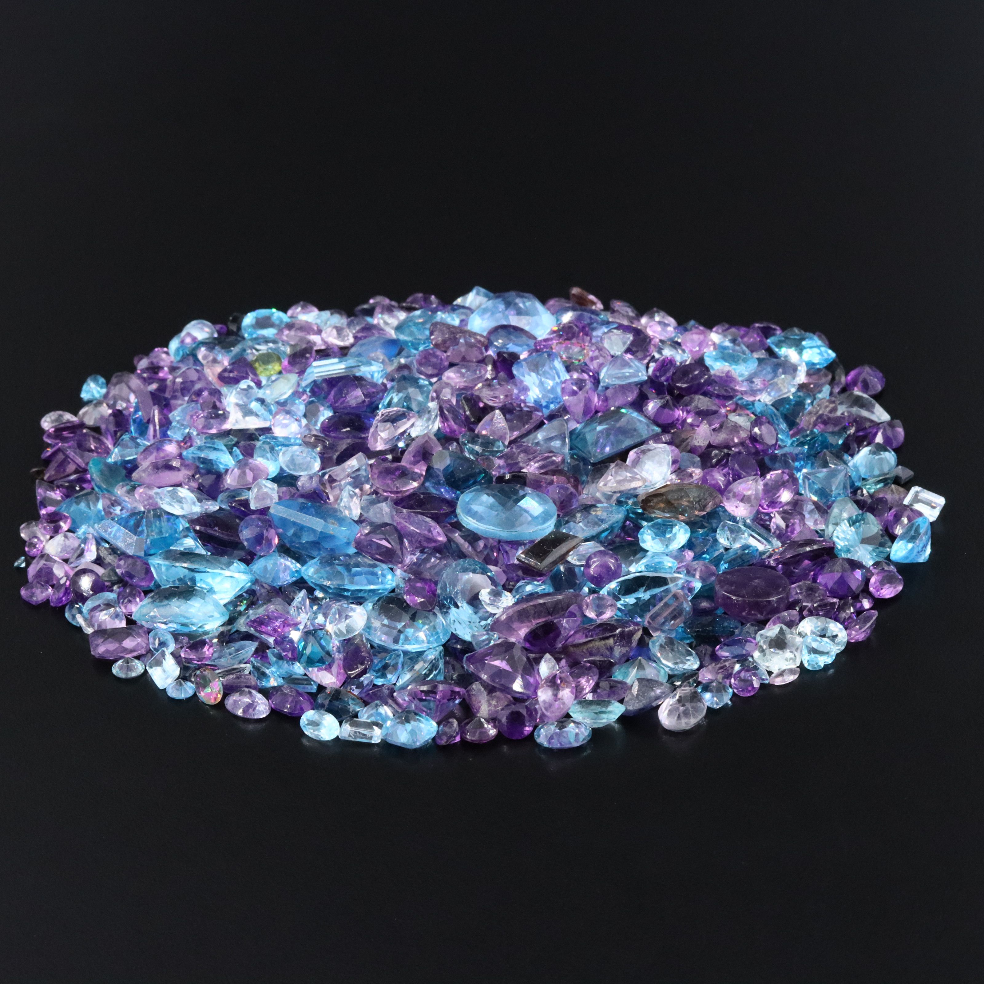 Loose 1022.00 CTW Gemstones Featuring Topaz, Amethyst and Smoky Quartz