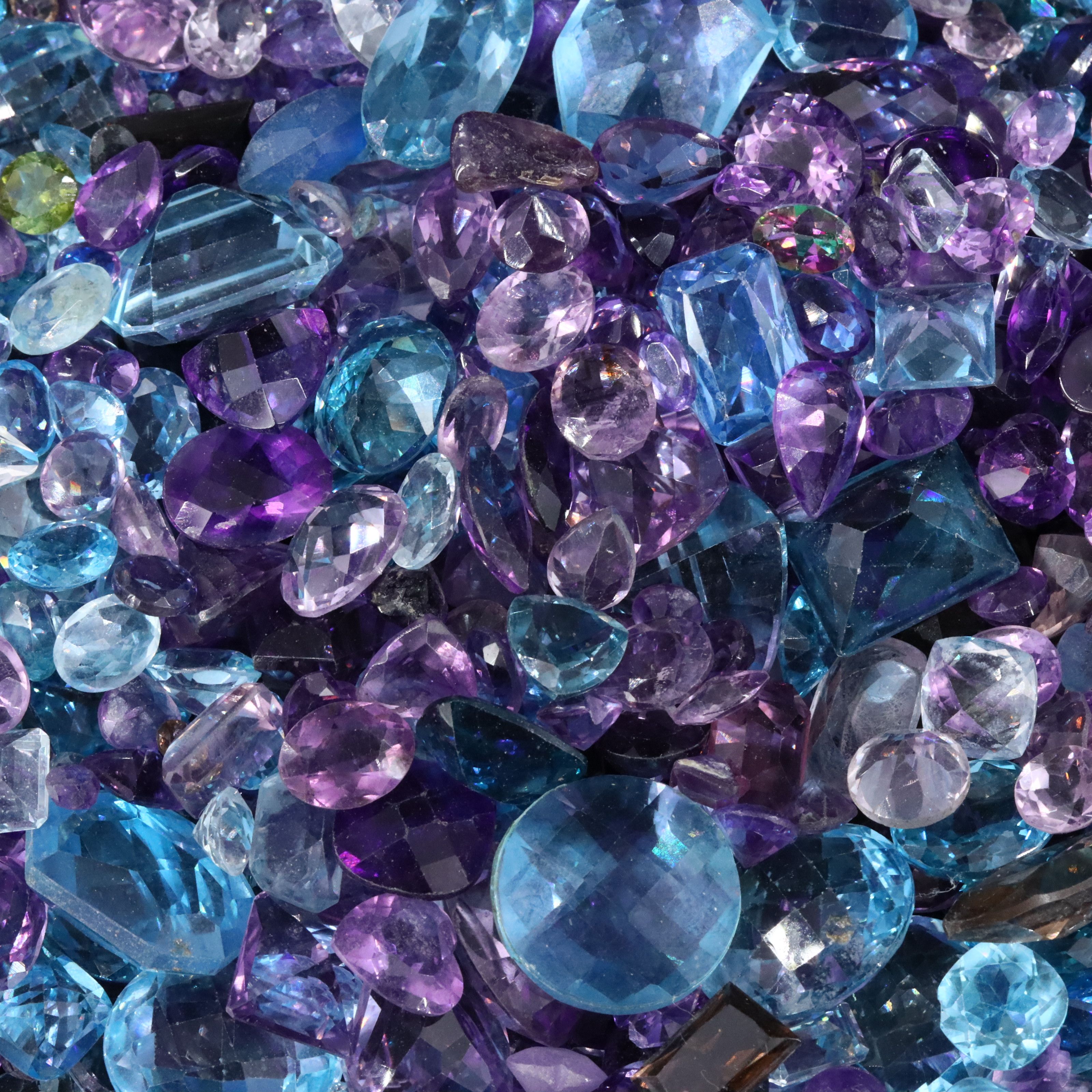 Loose 1022.00 CTW Gemstones Featuring Topaz, Amethyst and Smoky Quartz