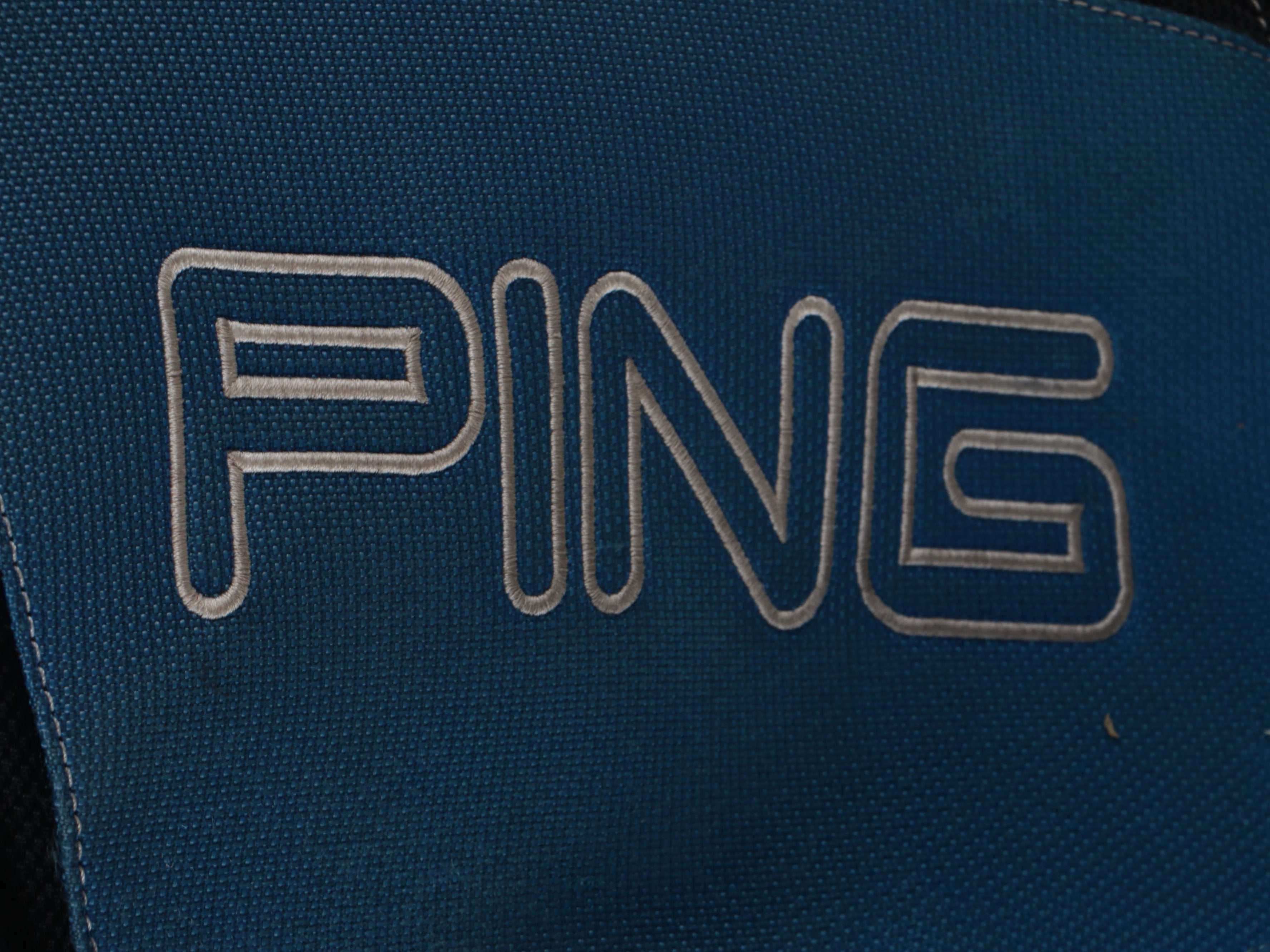 Karsten "Ping" Driver and Putters with Other Golf Clubs