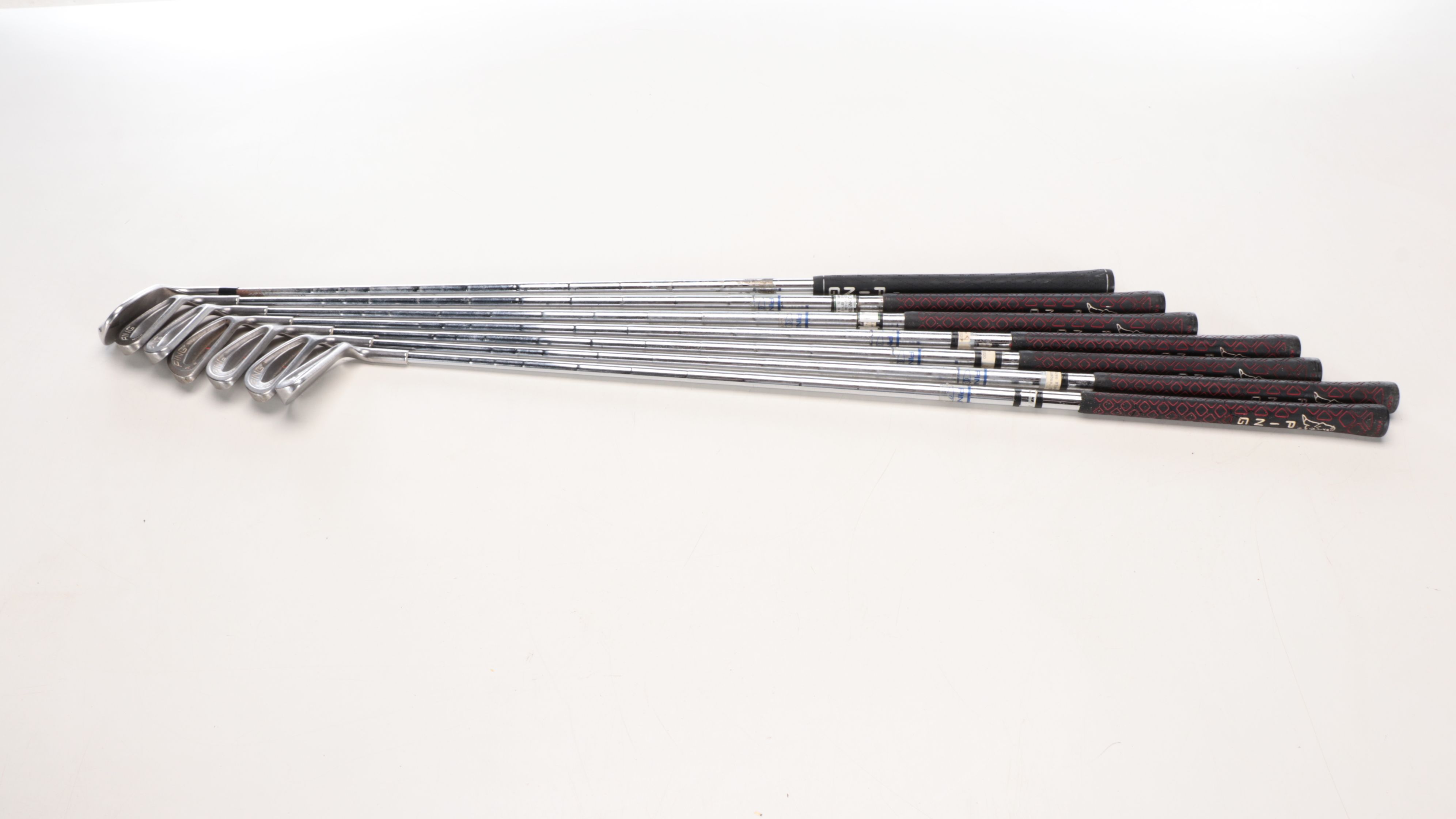 Karsten "Ping" Driver and Putters with Other Golf Clubs