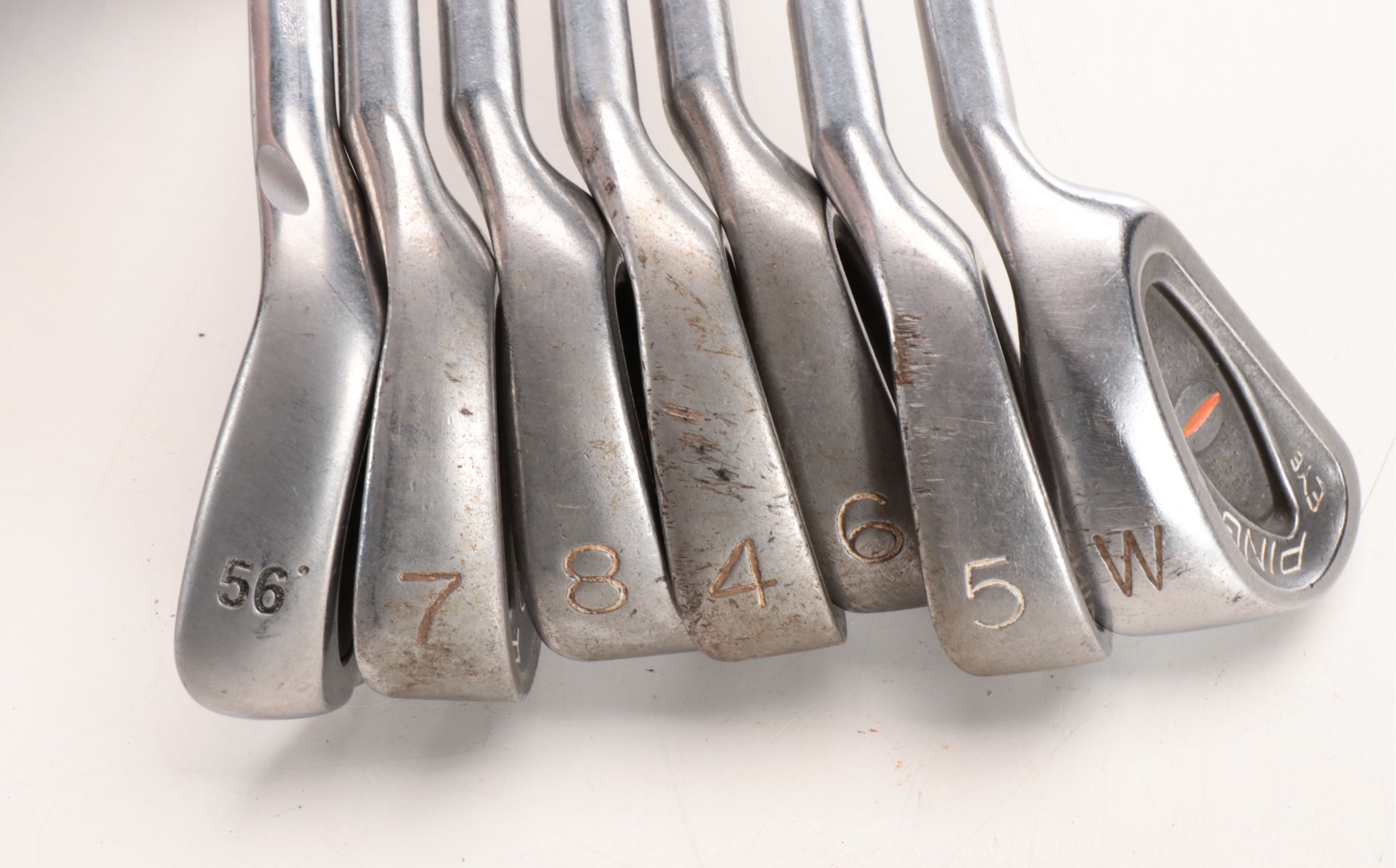 Karsten "Ping" Driver and Putters with Other Golf Clubs