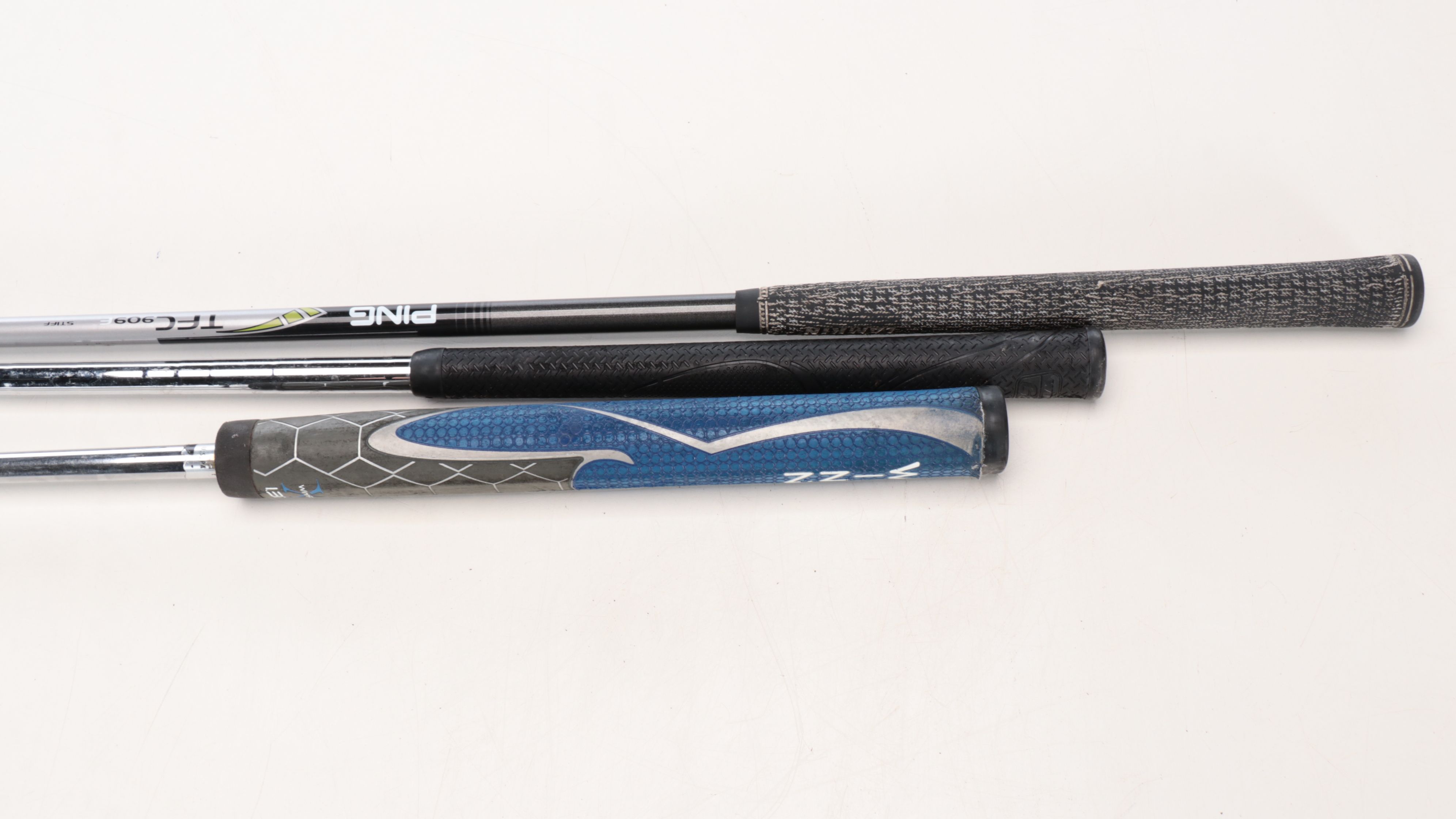 Karsten "Ping" Driver and Putters with Other Golf Clubs