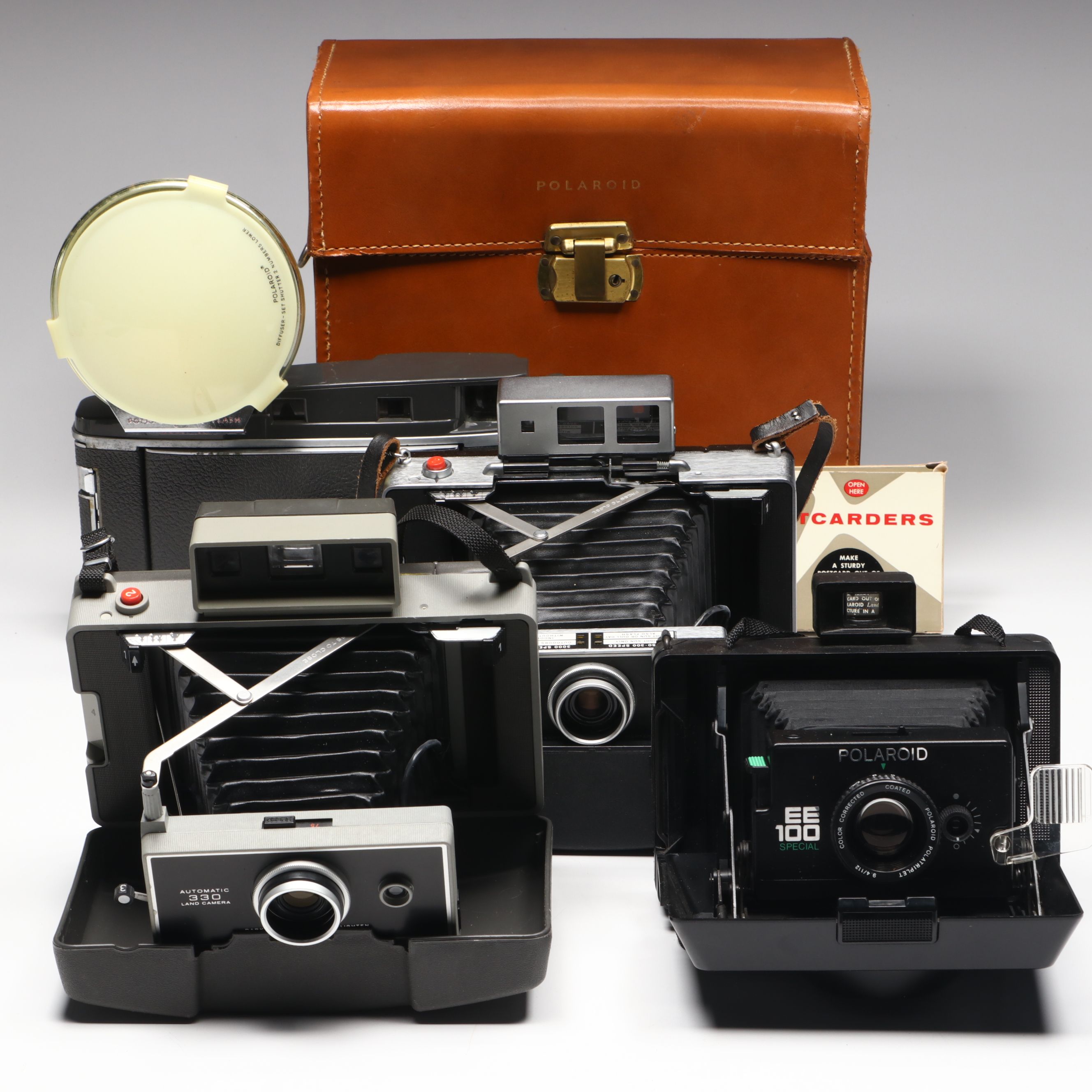 Polaroid Land Camera 150 in Case with More Folding Cameras, Mid to Late 20th C.