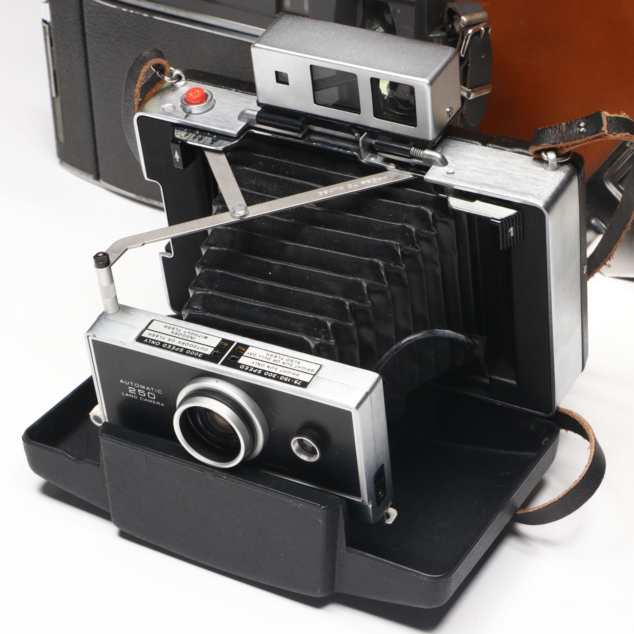 Polaroid Land Camera 150 in Case with More Folding Cameras, Mid to Late 20th C.
