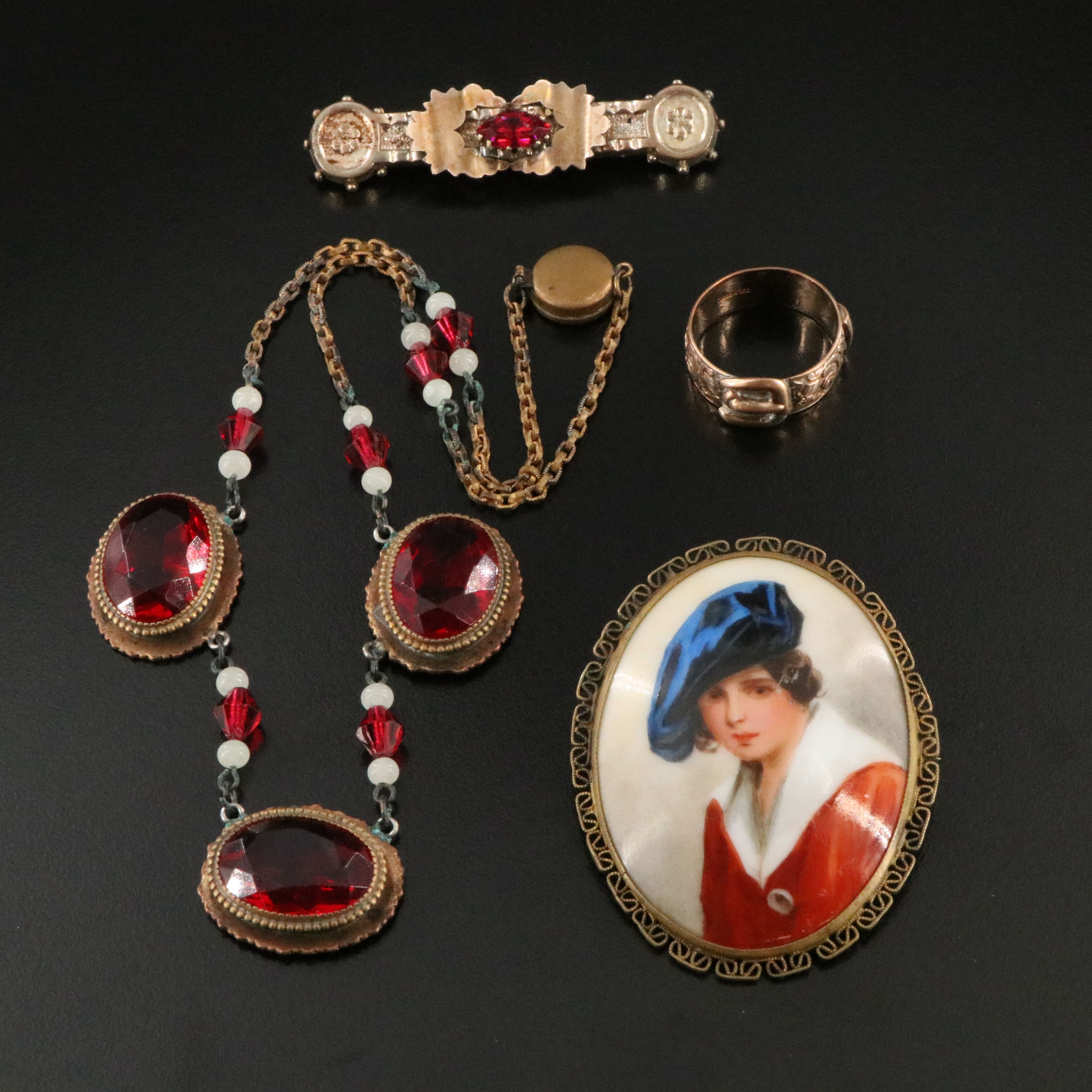 Victorian Buckle Ring and Bar Pin Featured in Jewelry Collection with Ruby Glass