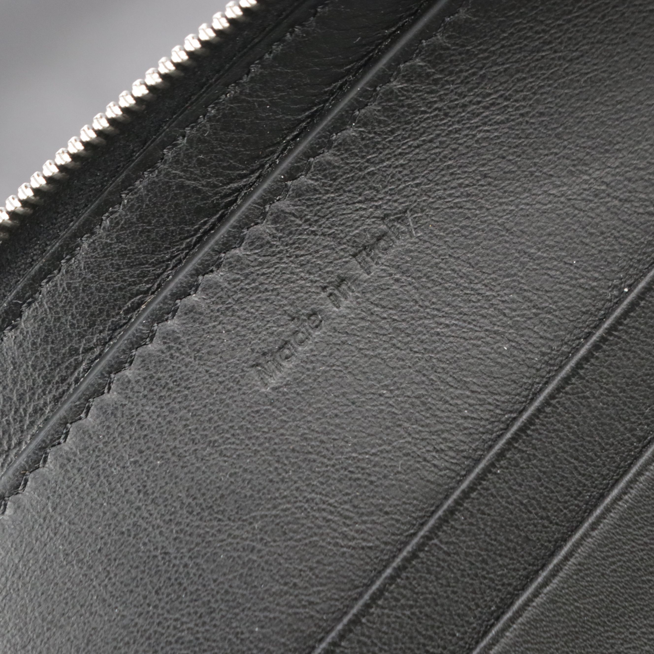 Céline Signature Embossed Black Leather Zip Clutch