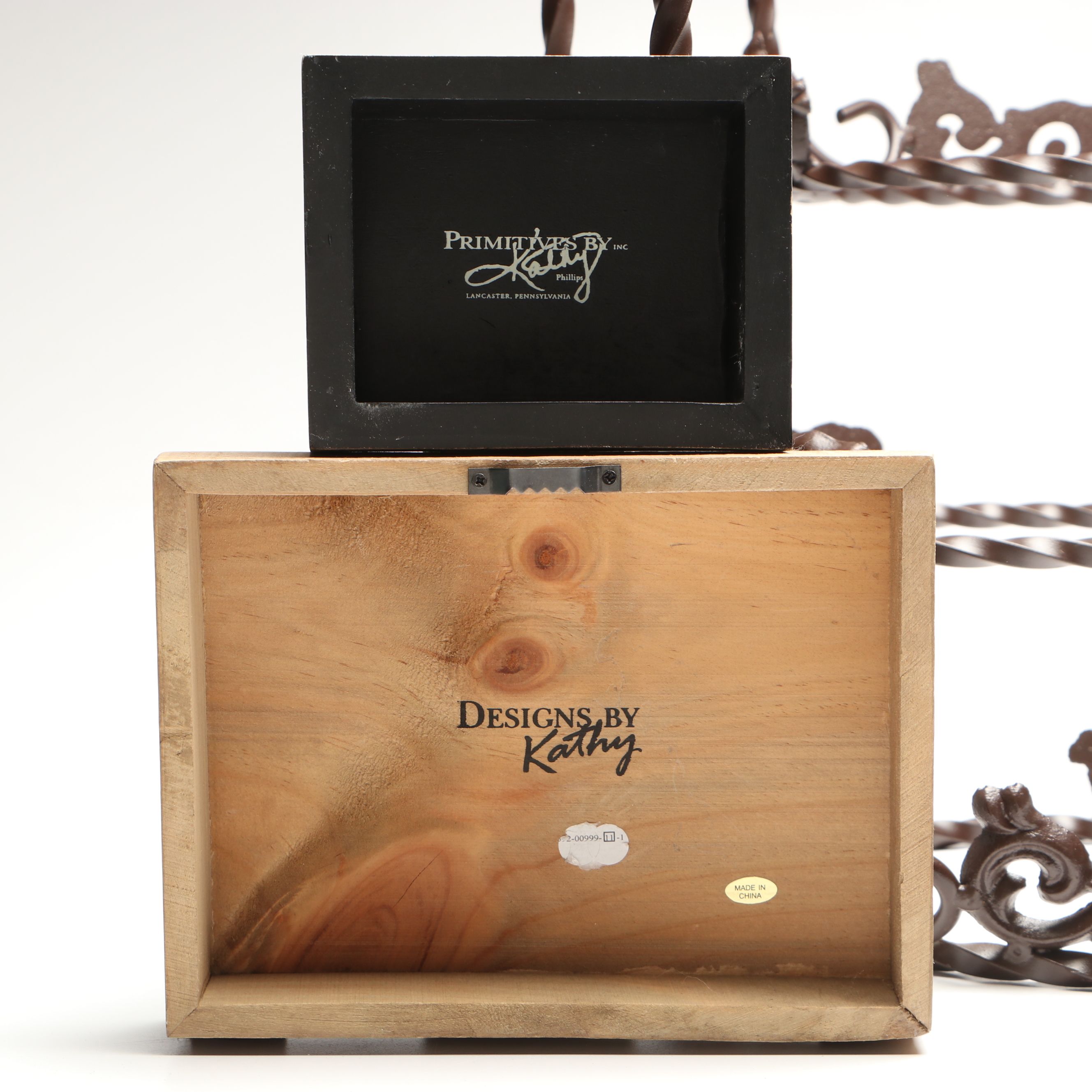 Tiered Cast Metal Plant Stand with Wooden Signs and Other Rustic Style Décor