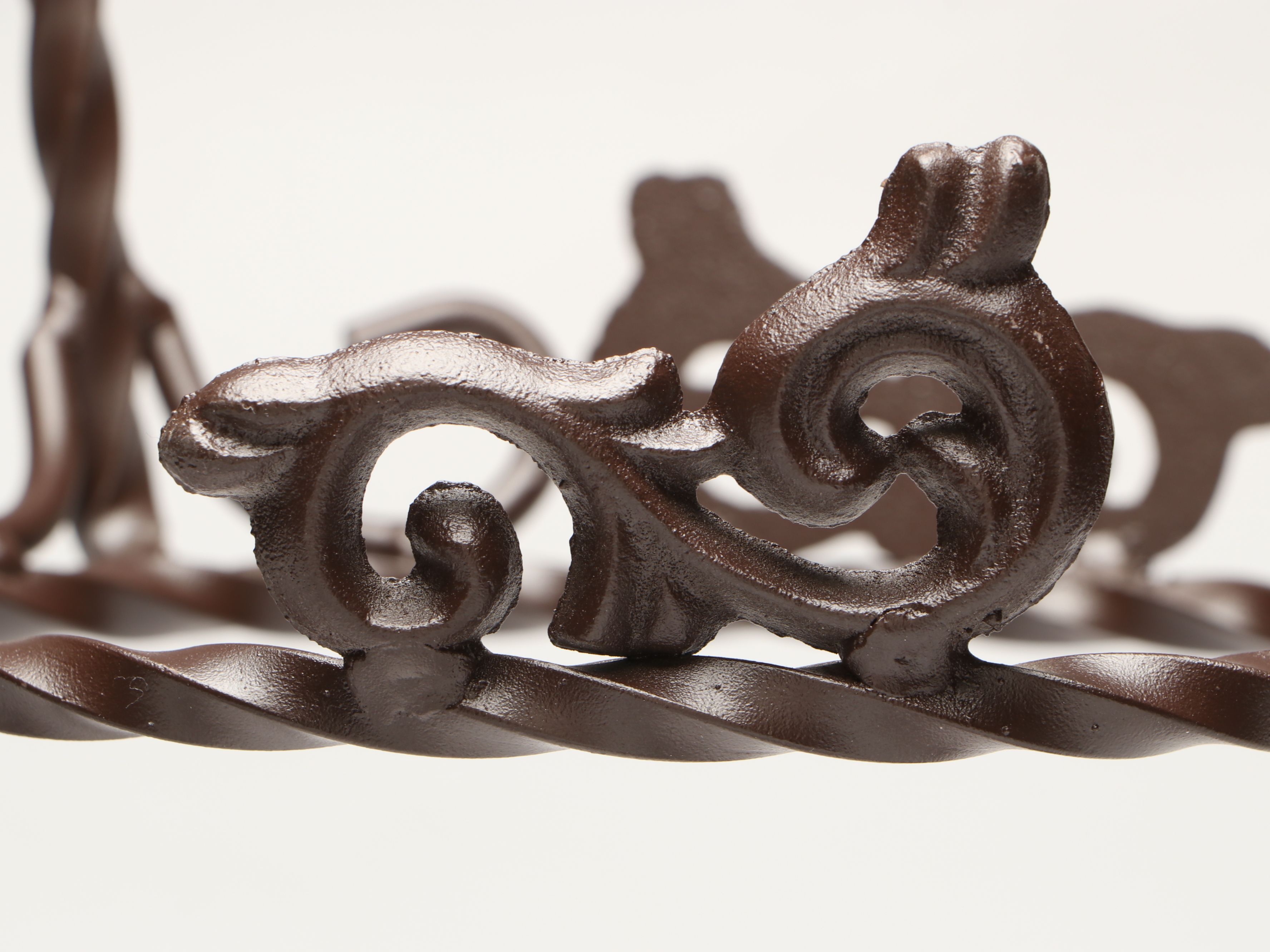 Tiered Cast Metal Plant Stand with Wooden Signs and Other Rustic Style Décor