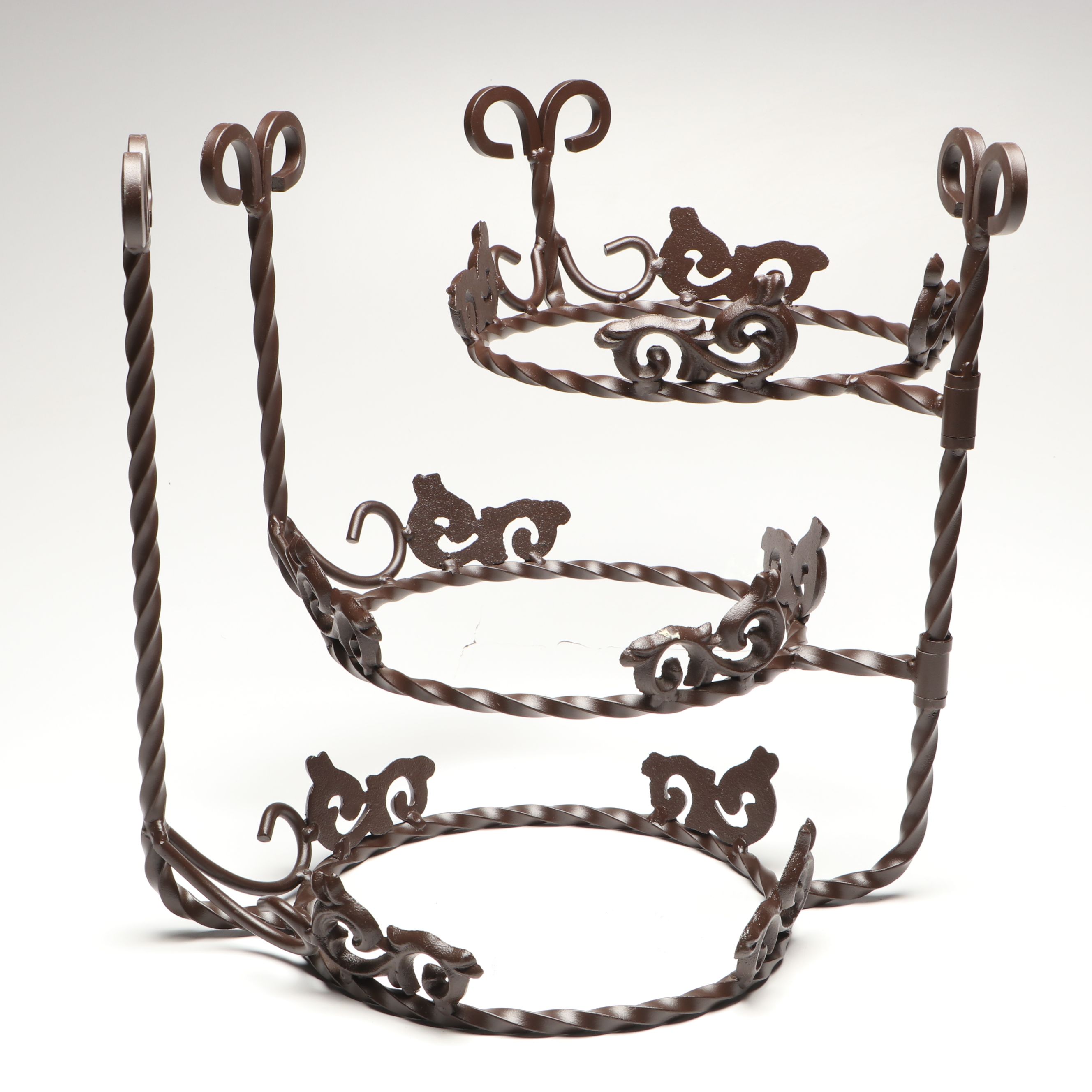 Tiered Cast Metal Plant Stand with Wooden Signs and Other Rustic Style Décor