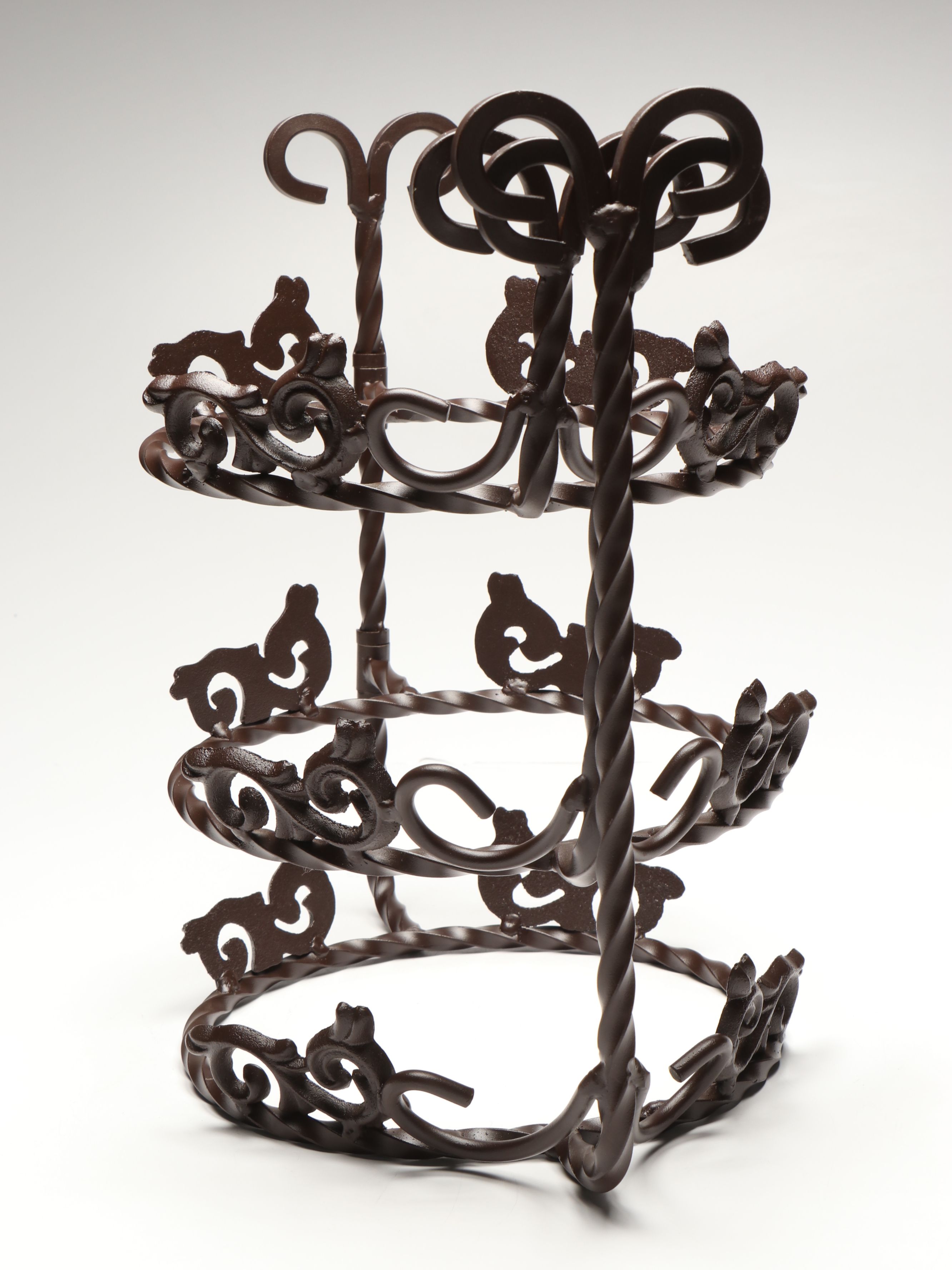 Tiered Cast Metal Plant Stand with Wooden Signs and Other Rustic Style Décor