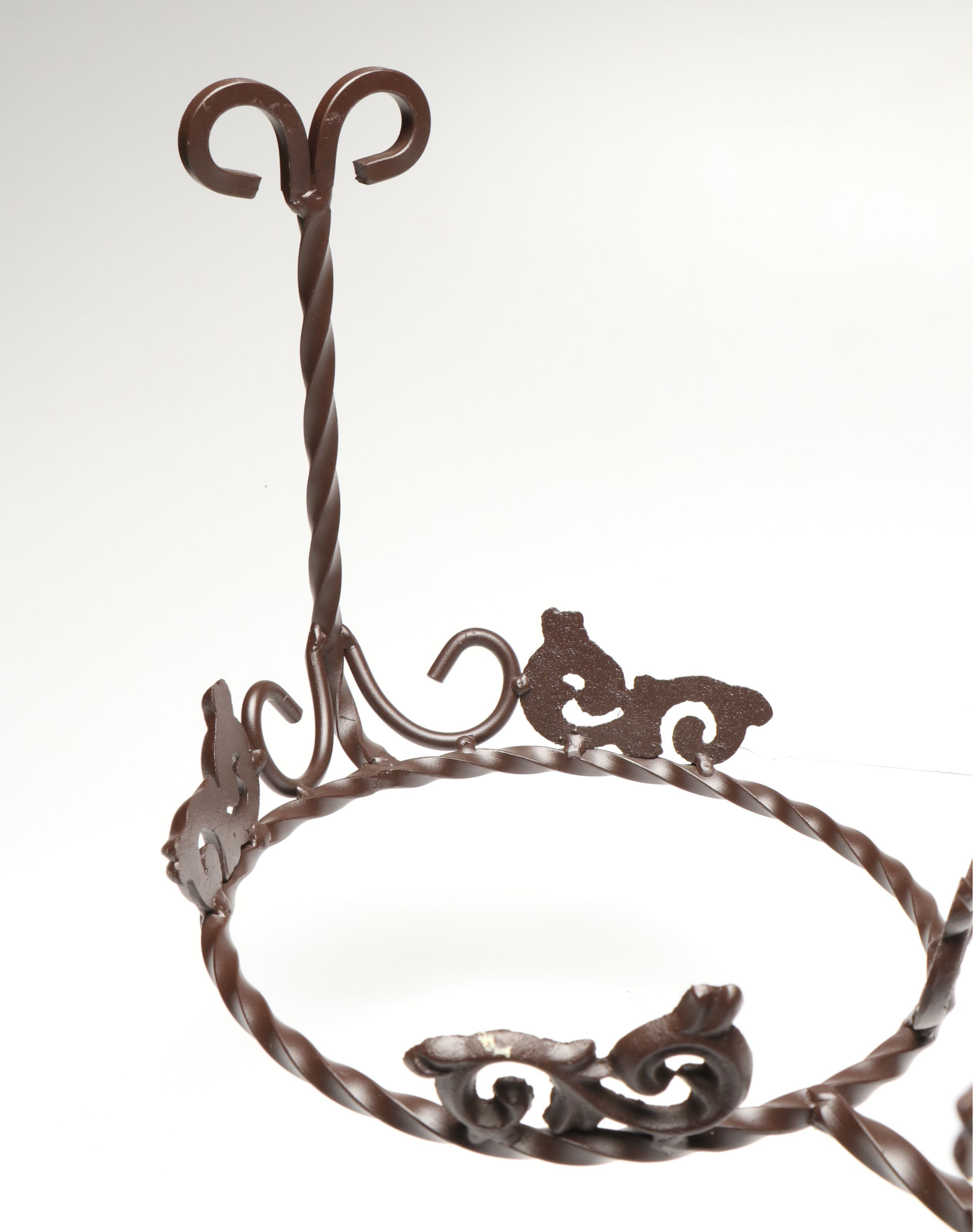 Tiered Cast Metal Plant Stand with Wooden Signs and Other Rustic Style Décor