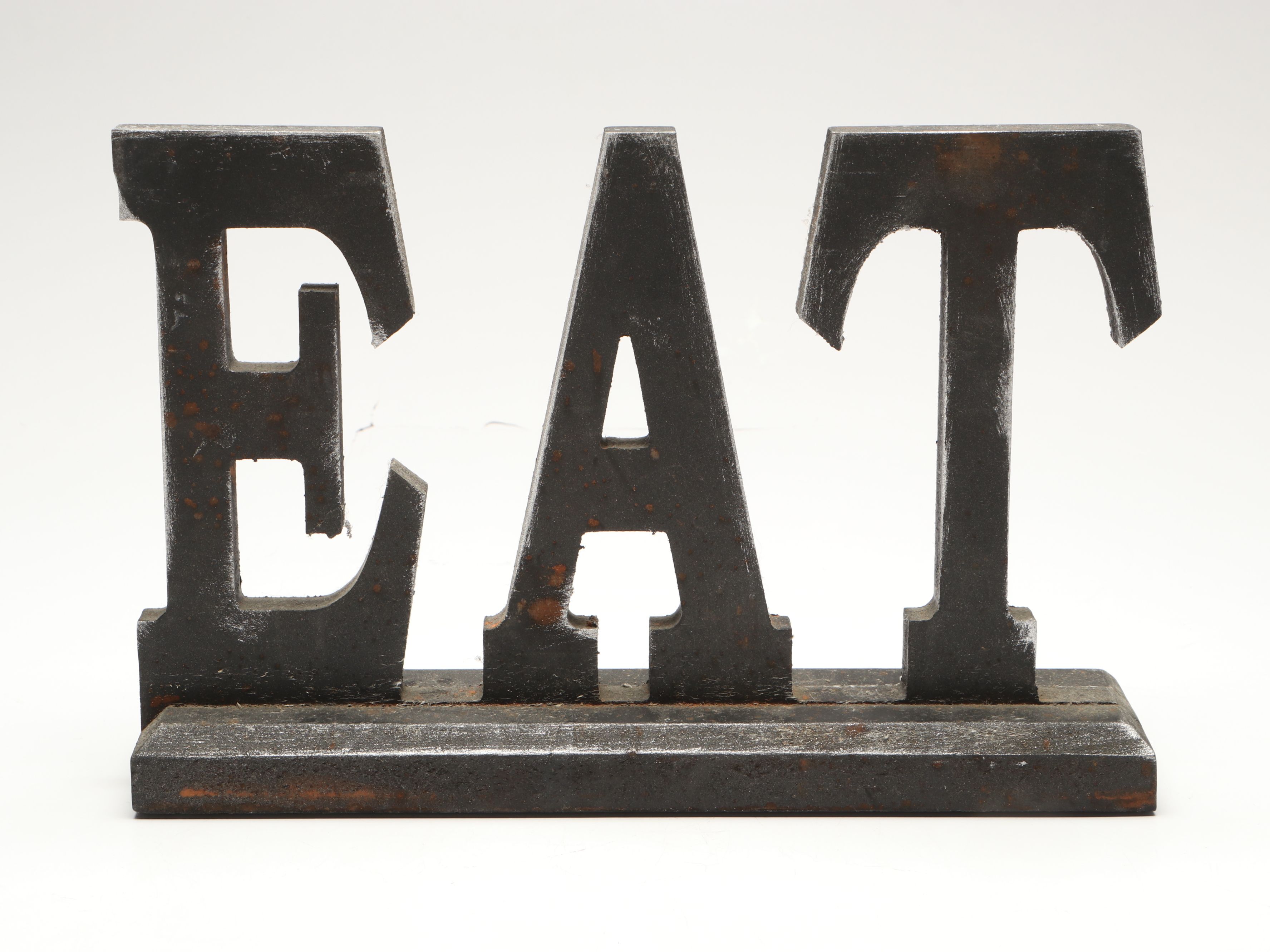 Tiered Cast Metal Plant Stand with Wooden Signs and Other Rustic Style Décor