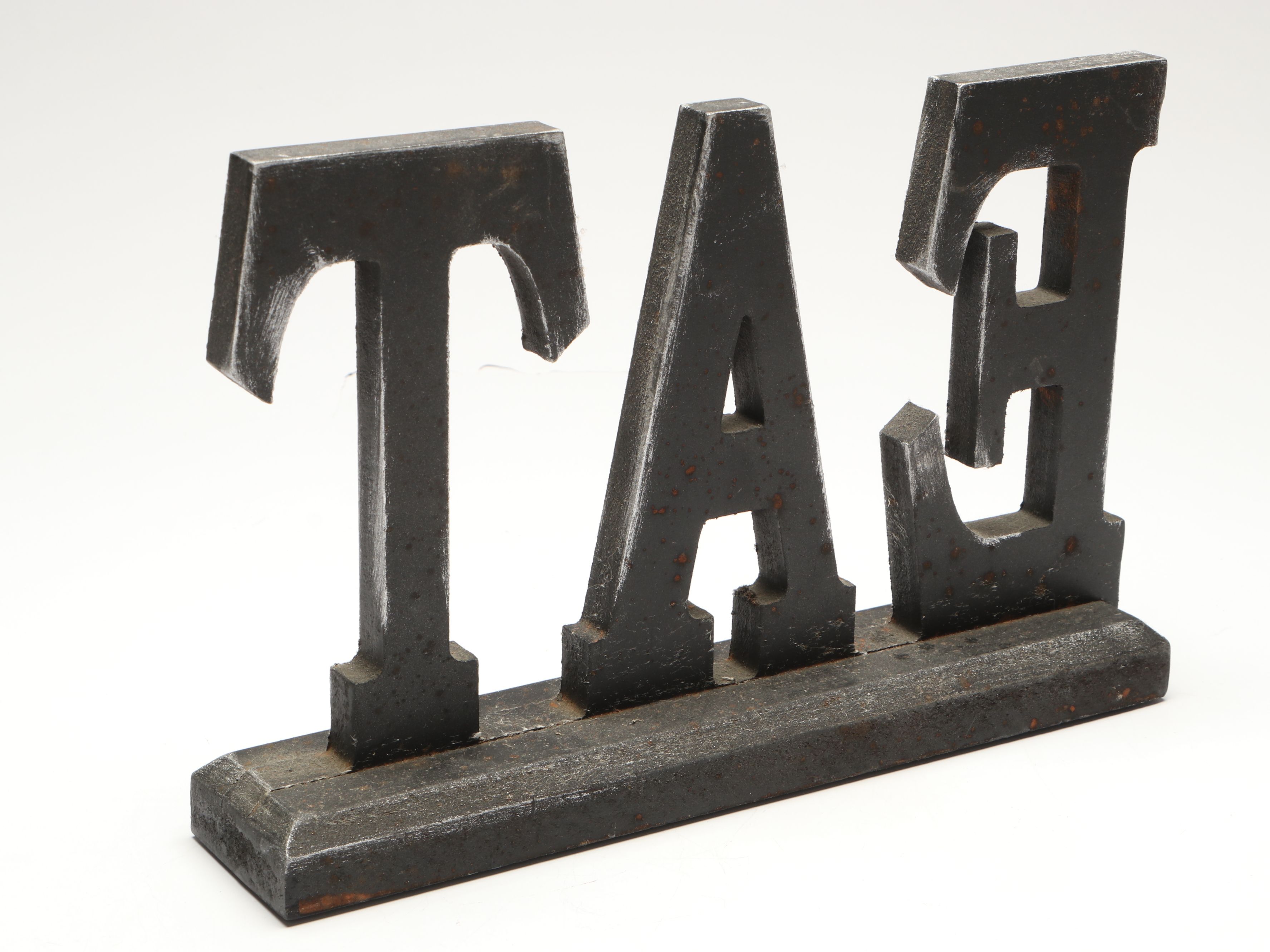 Tiered Cast Metal Plant Stand with Wooden Signs and Other Rustic Style Décor