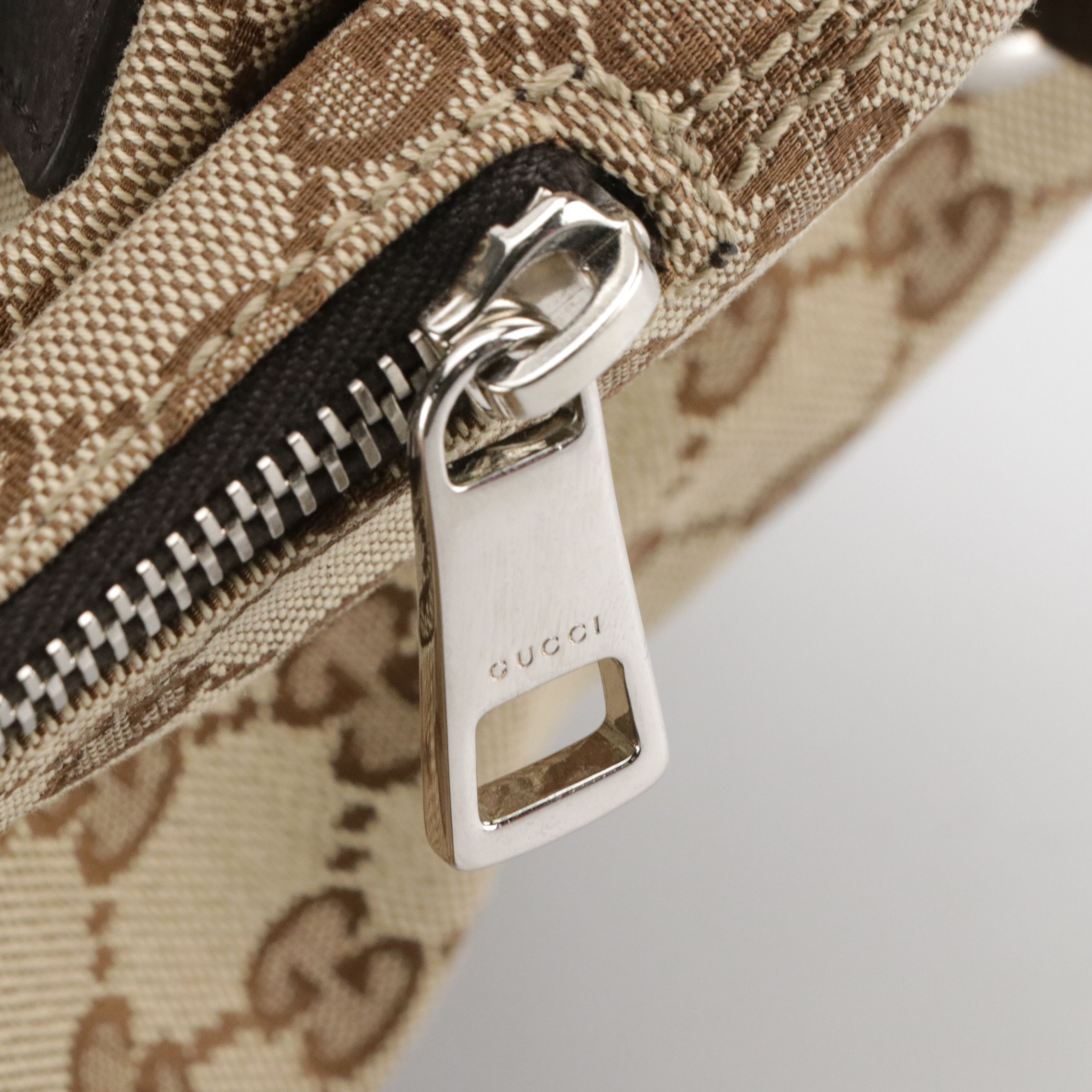 Gucci Side Zip Drawstring Backpack in Brown GG Canvas and Leather