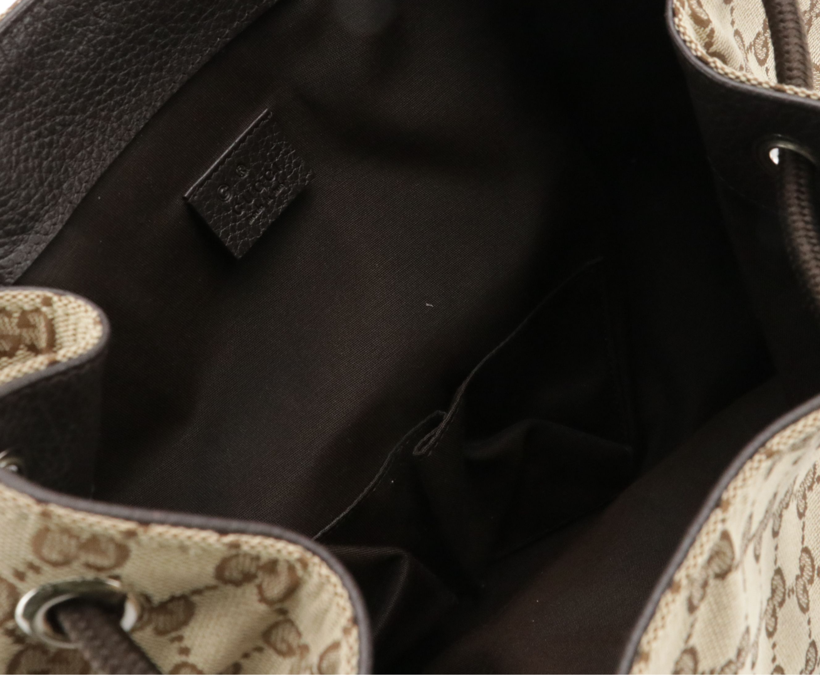 Gucci Side Zip Drawstring Backpack in Brown GG Canvas and Leather